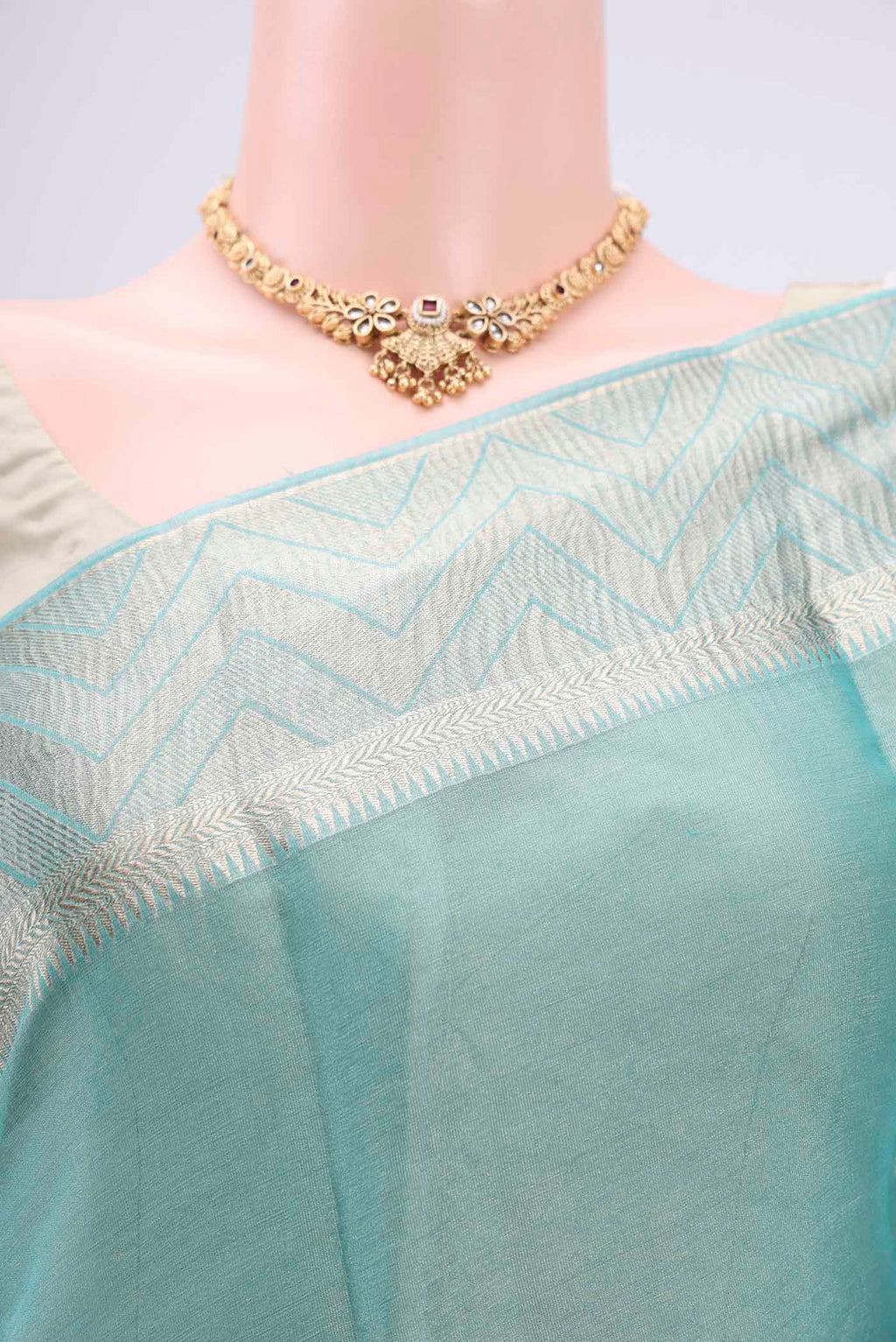 Border image of Sky Blue Mysore Crepe Saree with Fancy on the body and Zari Border. 