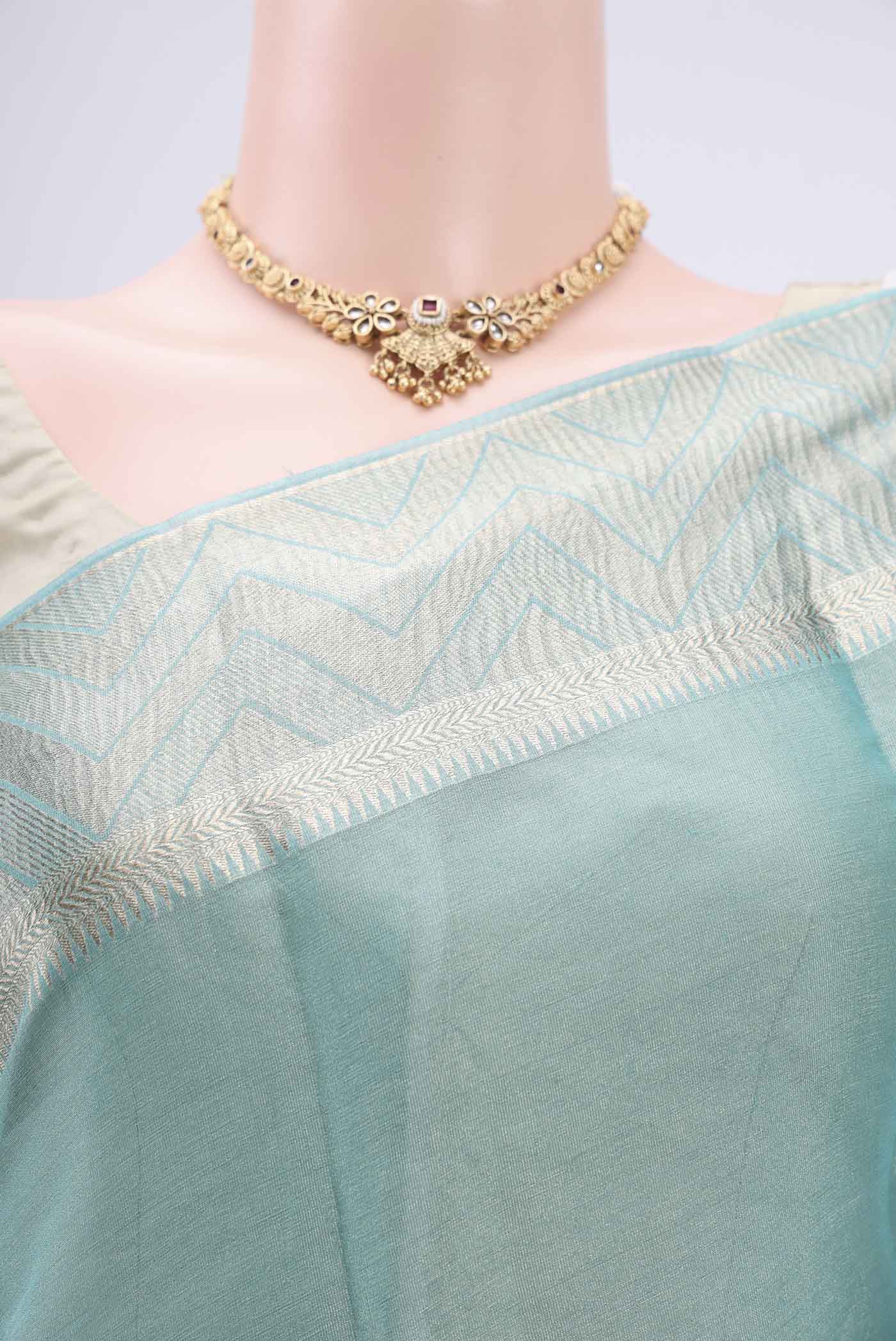Border image of Sky Blue Mysore Crepe Saree with Fancy on the body and Zari Border. 