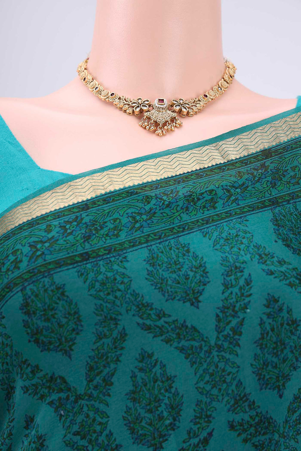 Border image of Turquoise Mysore Crepe Saree with Floral Print on the body and Zari Border. 