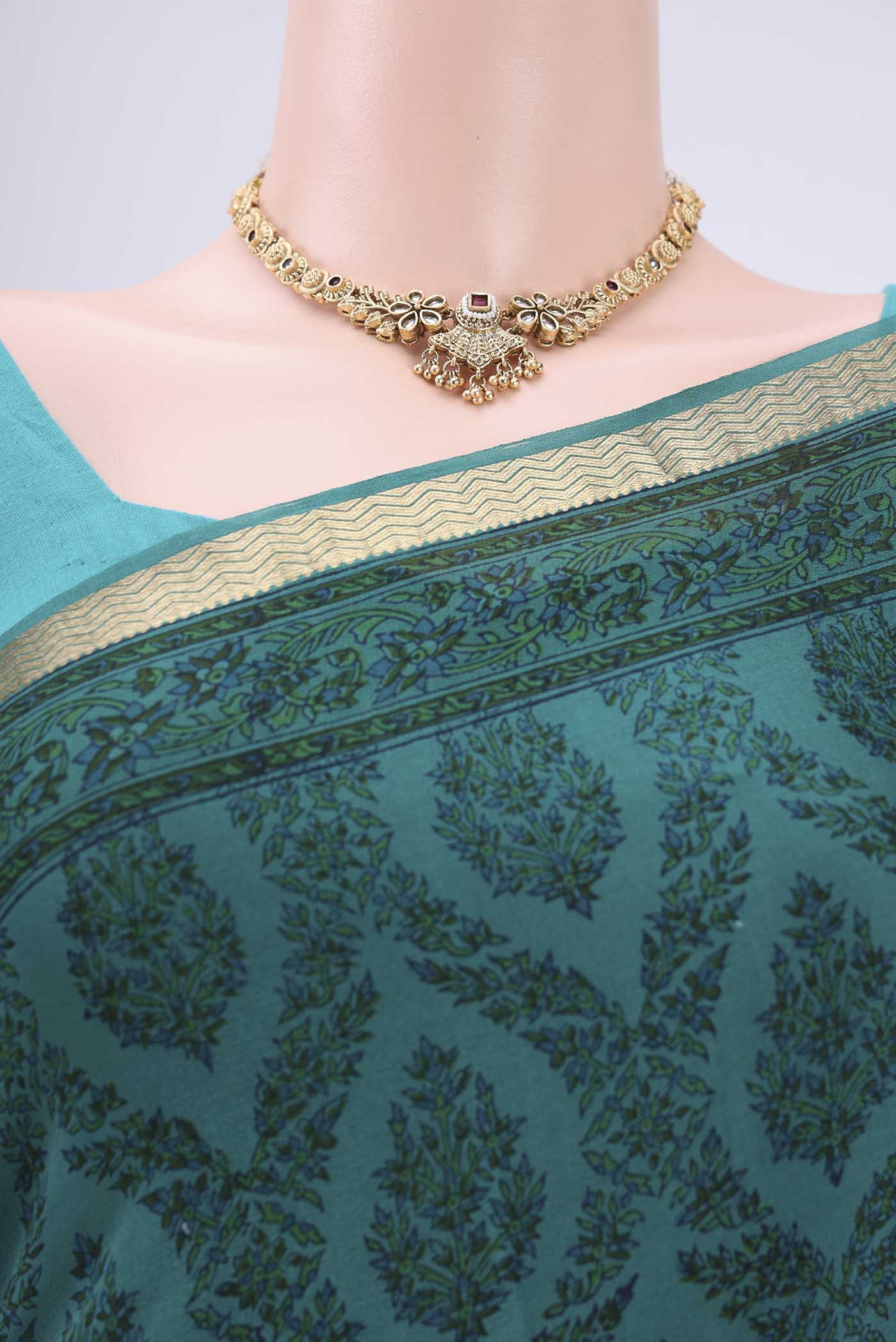 Border image of Turquoise Mysore Crepe Saree with Floral Print on the body and Zari Border. 
