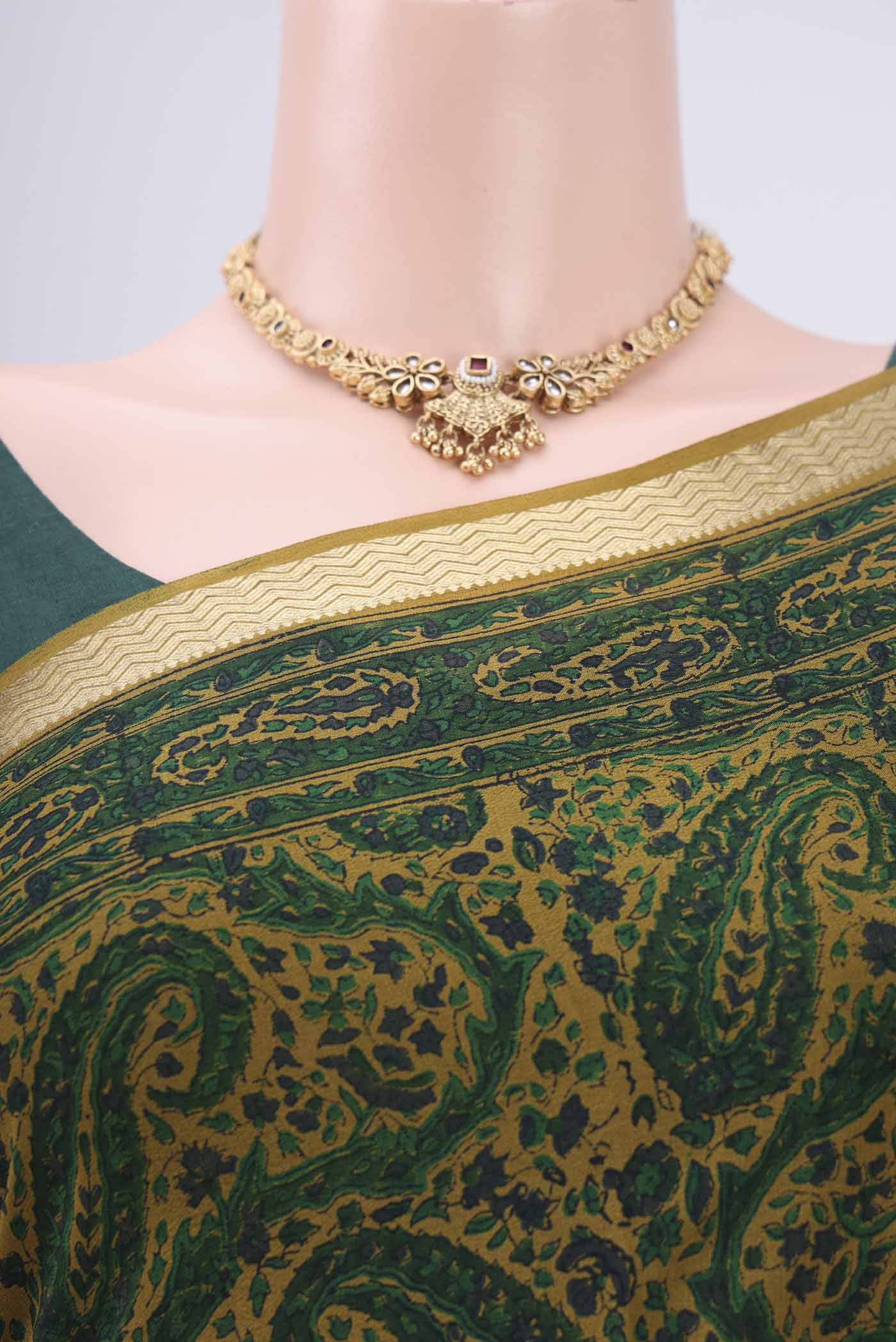 Border image of Green Mysore Crepe Saree with Floral Print on the body and Zari Border. 