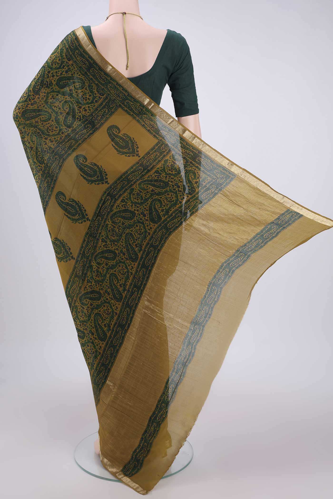 Flat view of Green Mysore Crepe Saree with Floral Print on the body and Zari Border. 
