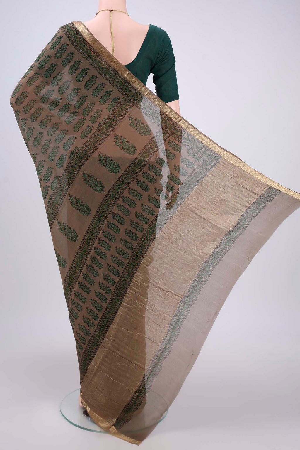 Flat view of Brown Mysore Crepe Saree with Floral Print on the body and Zari Border. 