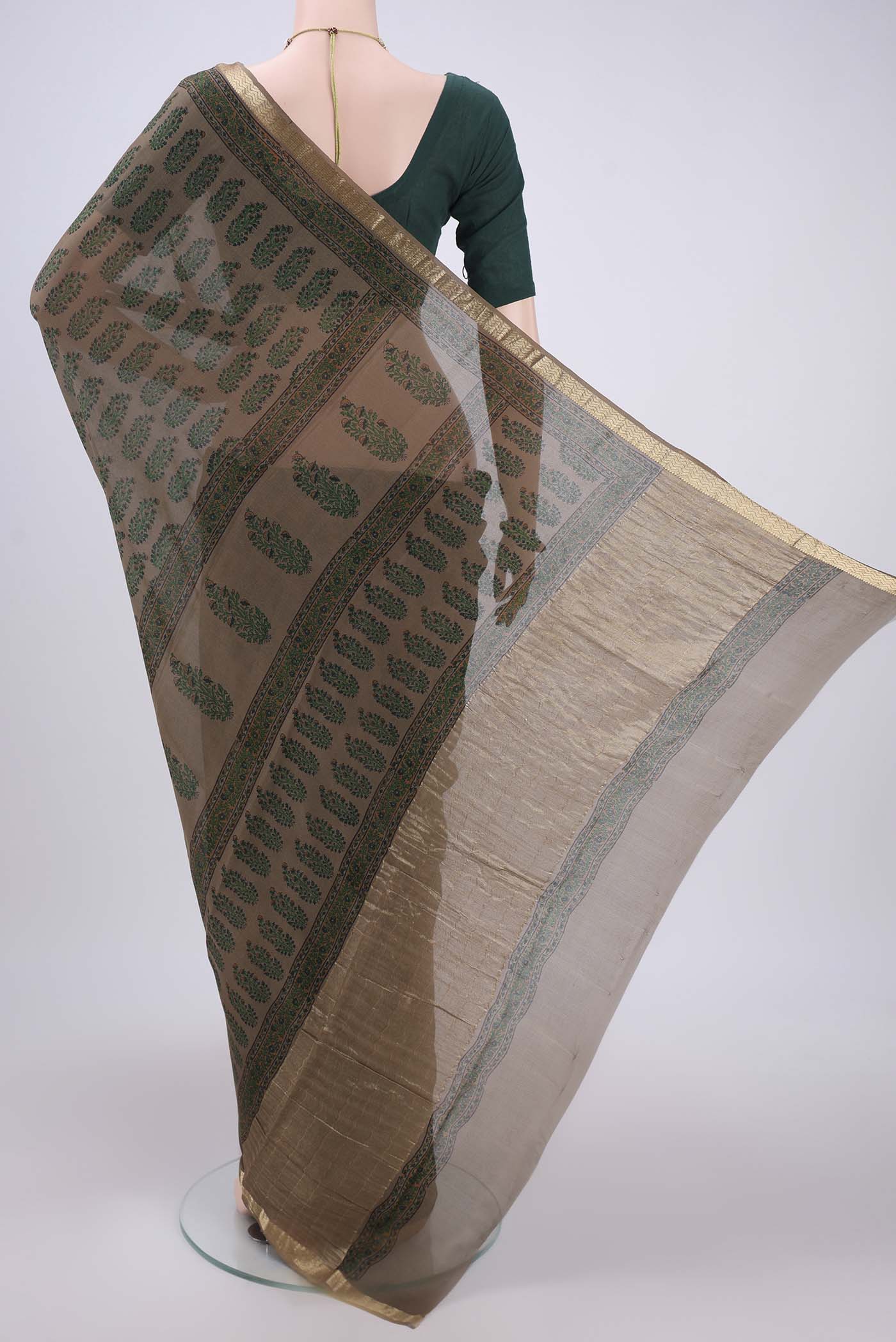 Flat view of Brown Mysore Crepe Saree with Floral Print on the body and Zari Border. 