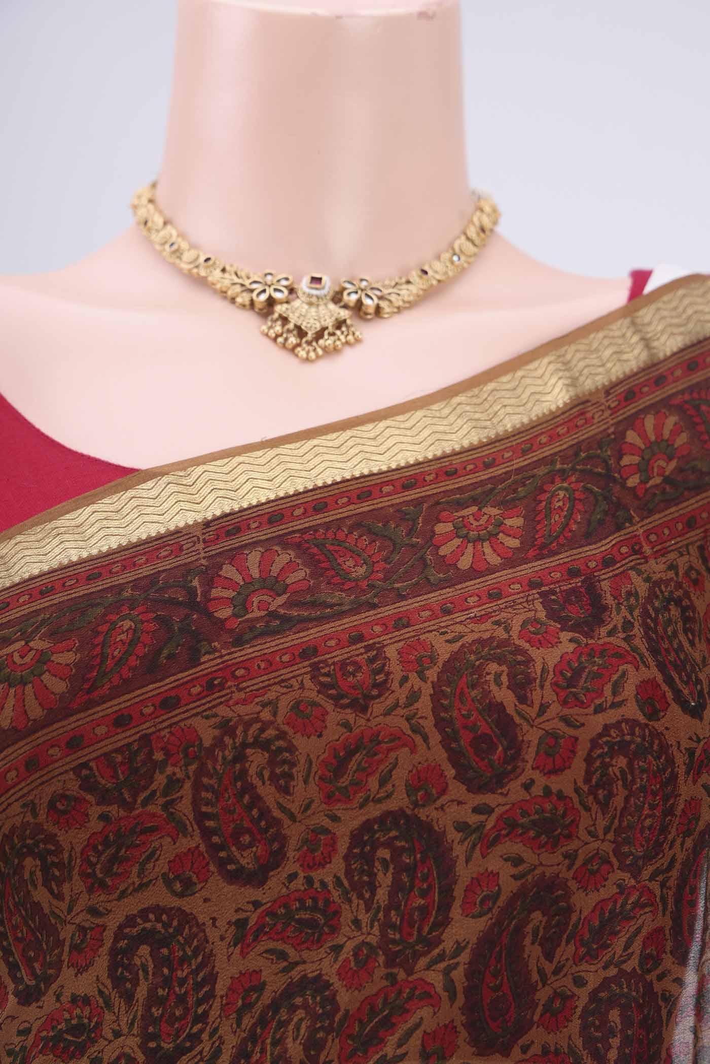 Border image of Brown Mysore Crepe Saree with Floral Print on the body and Zari Border. 