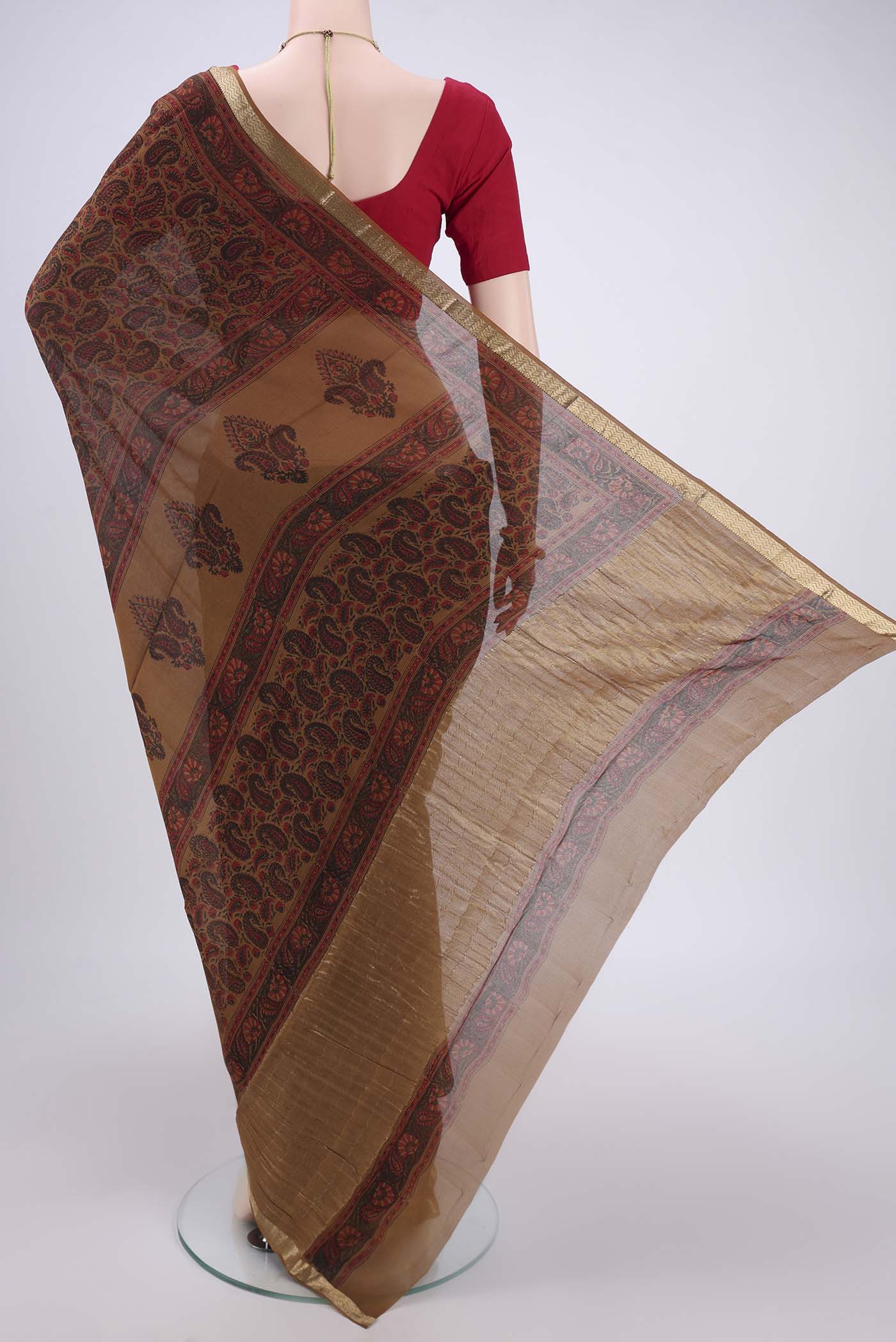 Flat view of Brown Mysore Crepe Saree with Floral Print on the body and Zari Border. 