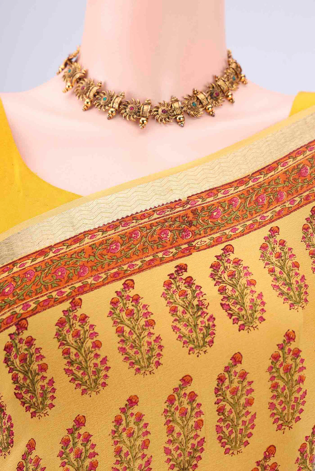 Border image of Yellow Mysore Crepe Saree with Floral Print on the body and Zari Border. 