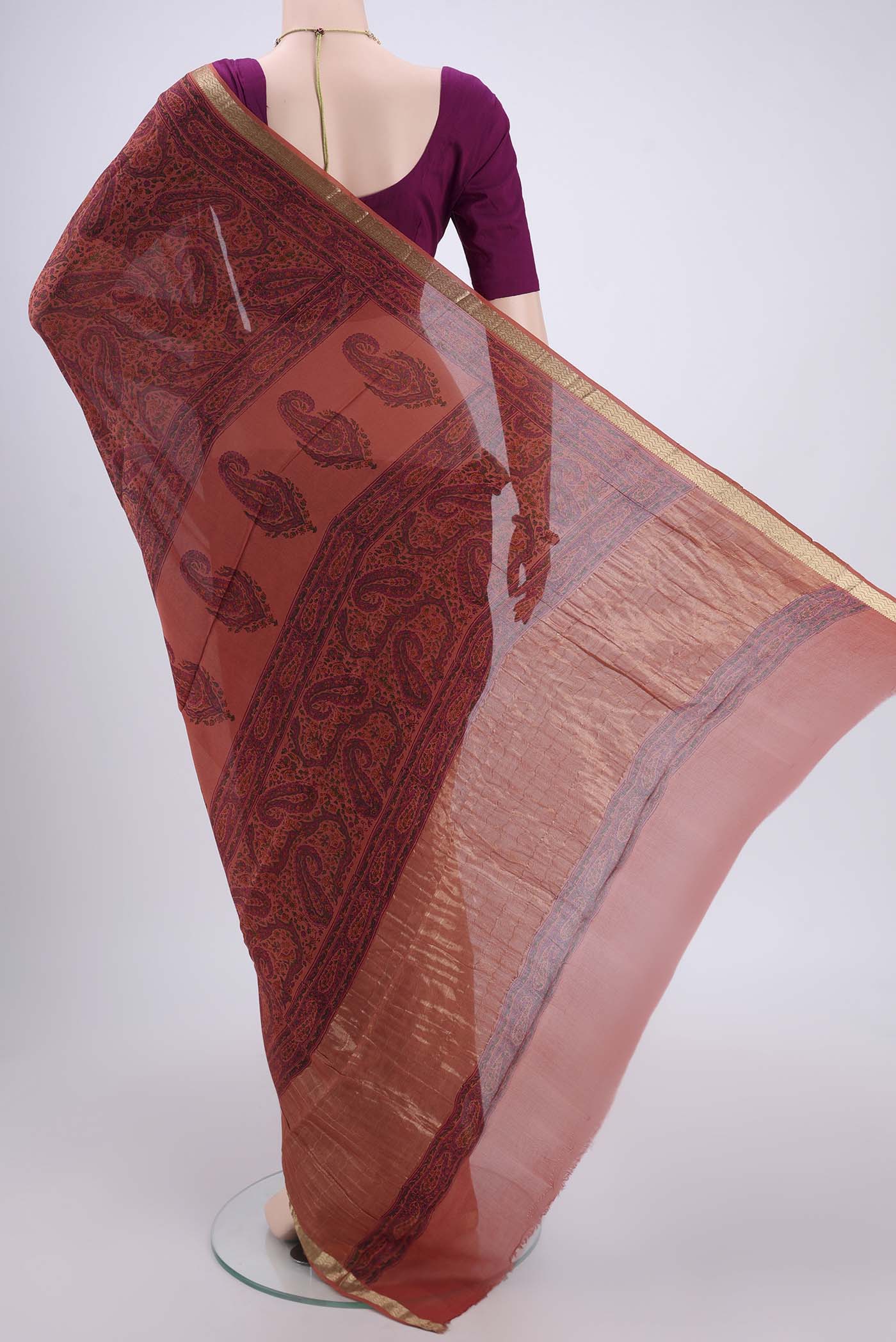 Flat view of Peach Mysore Crepe Saree with Floral Print on the body and Zari Border. 