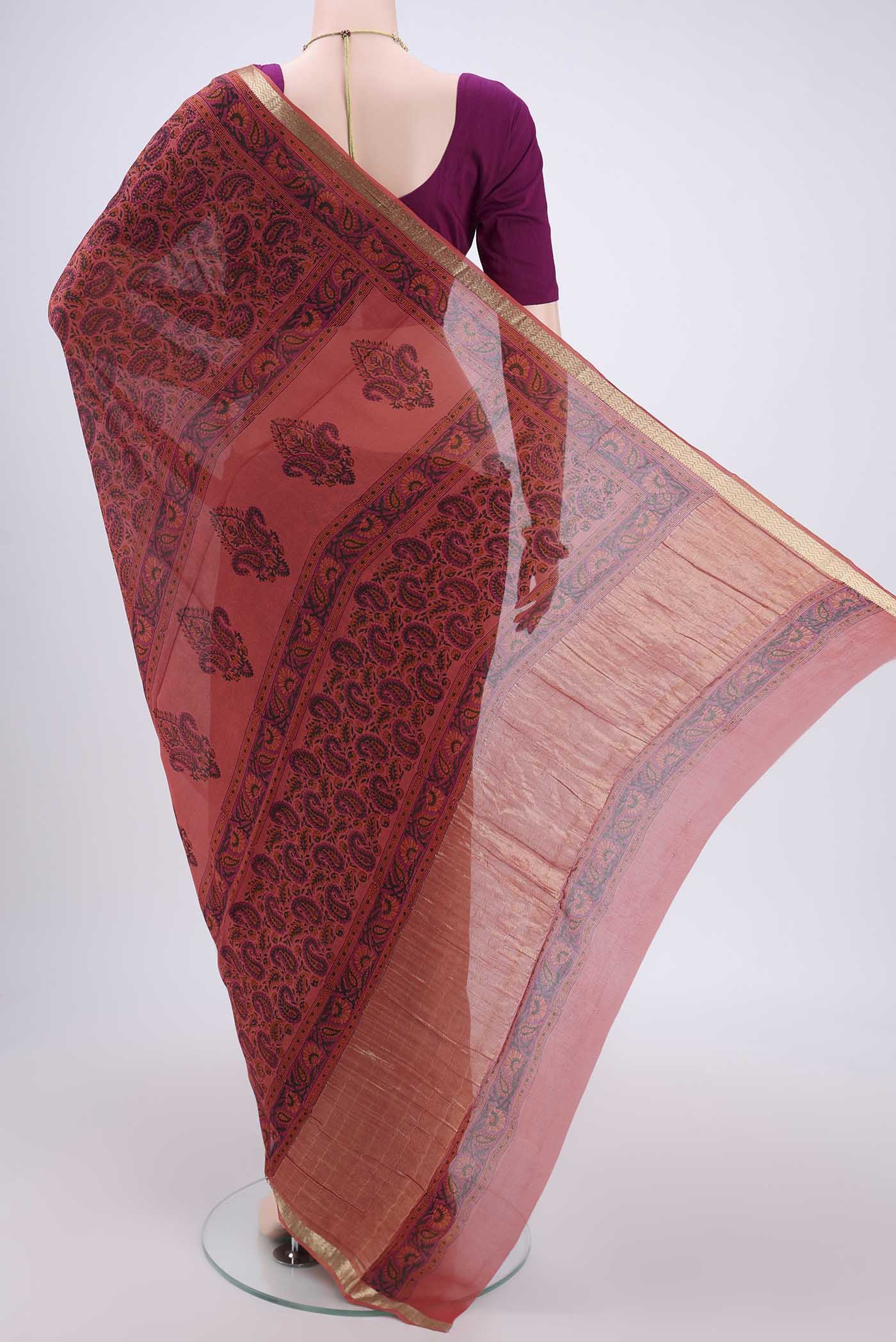 Flat view of Peach Mysore Crepe Saree with Floral Print on the body and Zari Border. 