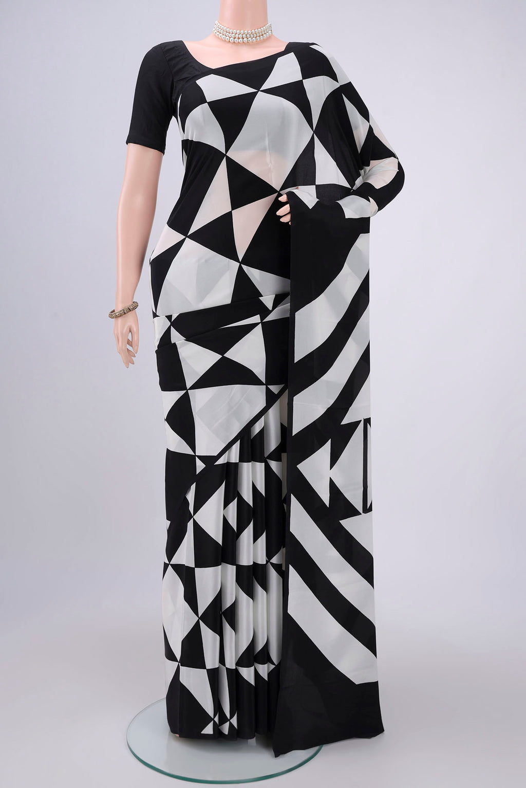 Black Mysore Crepe Saree with Floral Print on the body and Without Border.  displayed on a mannequin