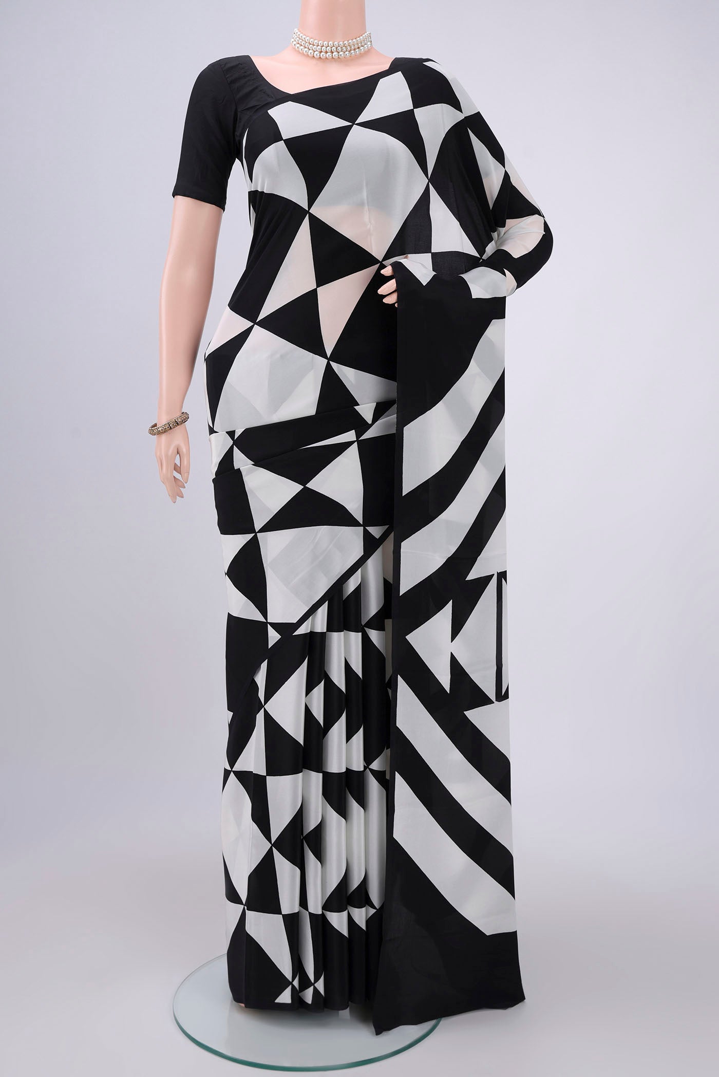 Black Mysore Crepe Saree with Floral Print on the body and Without Border.  displayed on a mannequin