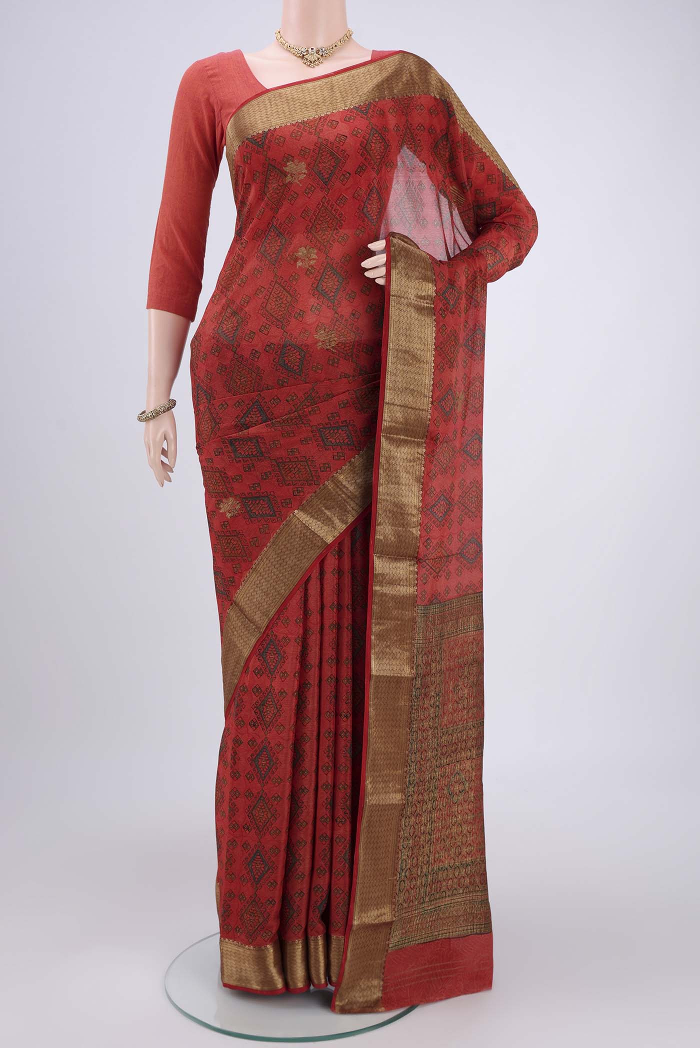 Maroon Mysore Crepe Saree with Floral Print on the body and Without Border.  displayed on a mannequin