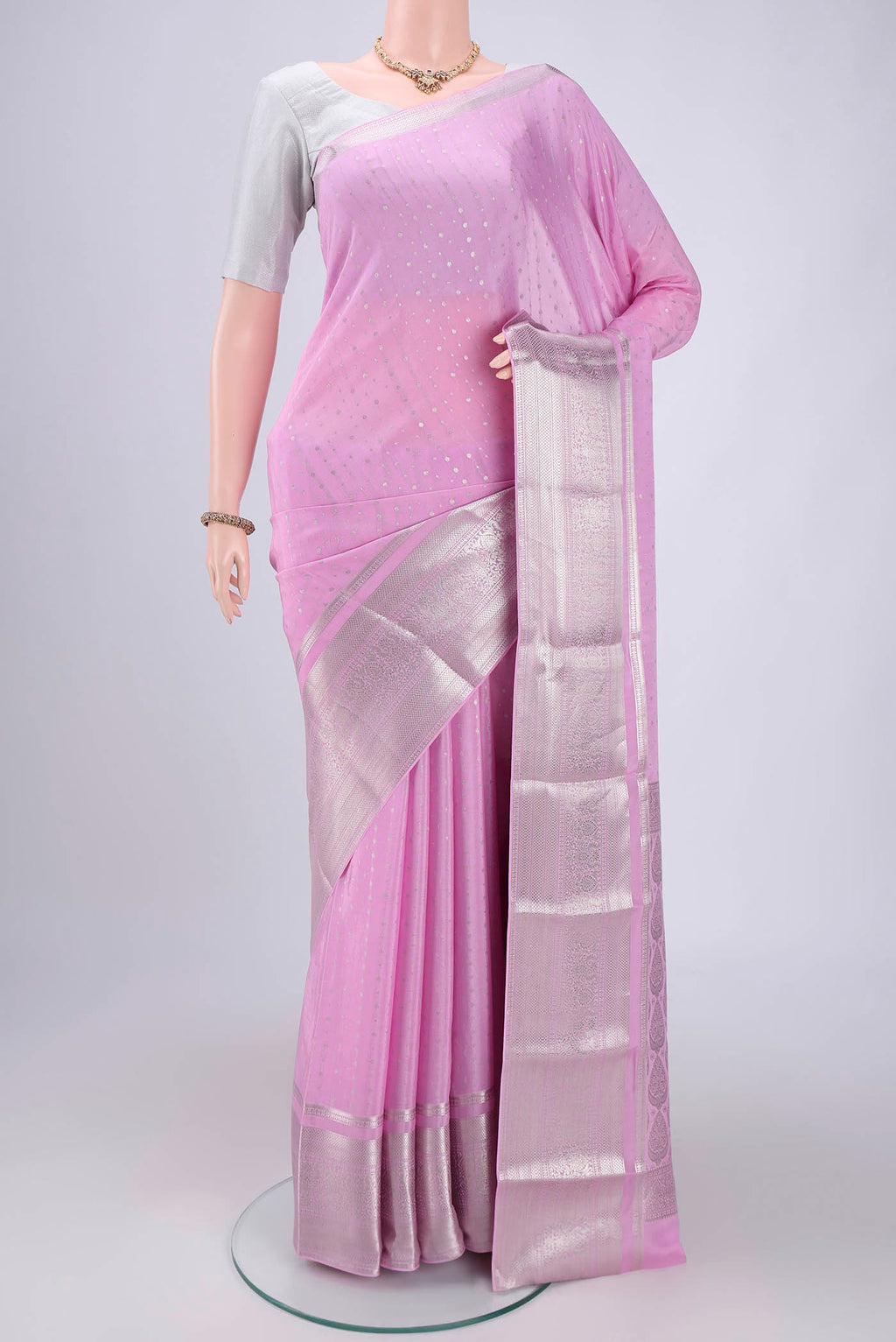 Pink Mysore Crepe Saree with Zari Butta on the body and Zari Border.  displayed on a mannequin