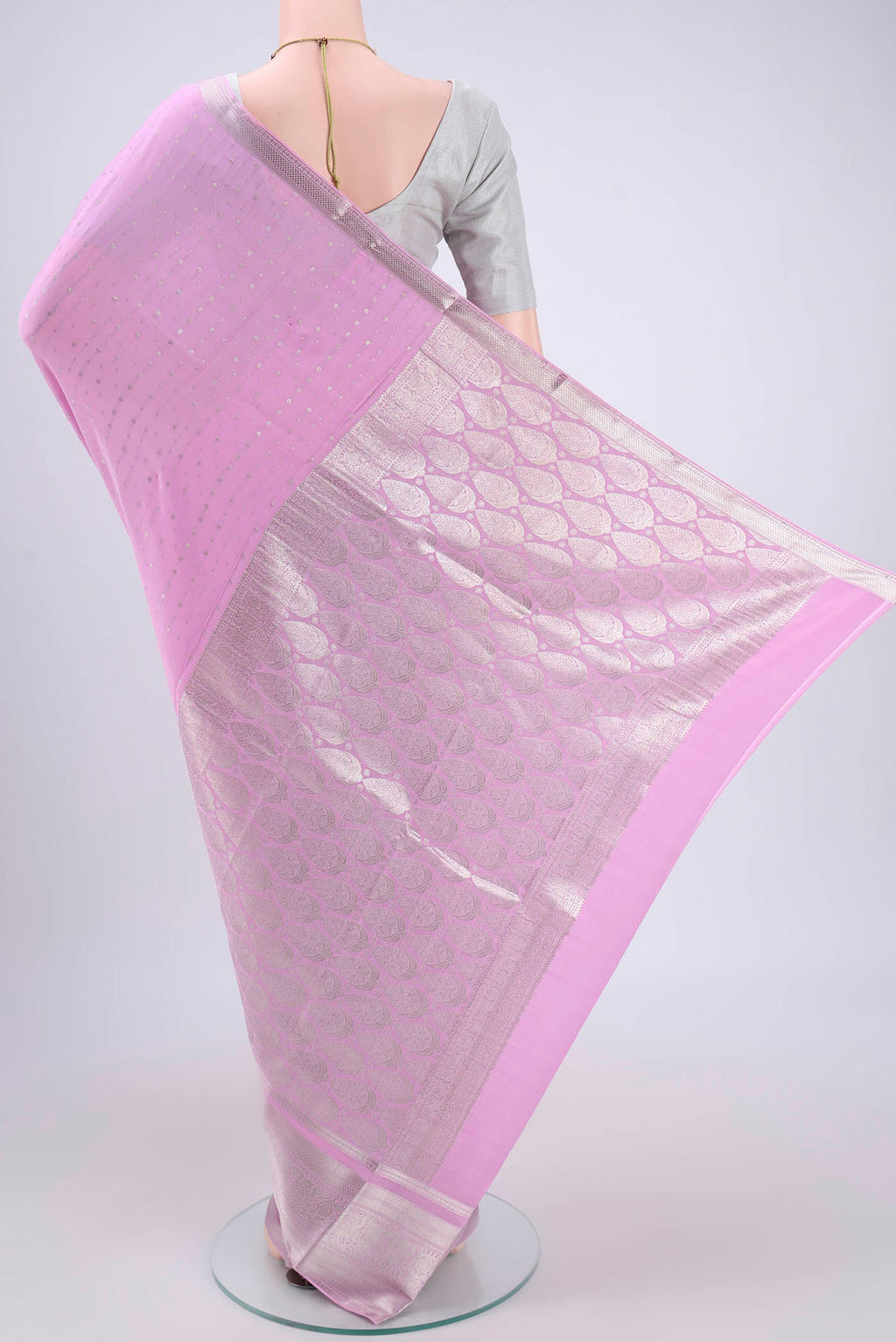 Flat view of Pink Mysore Crepe Saree with Zari Butta on the body and Zari Border. 
