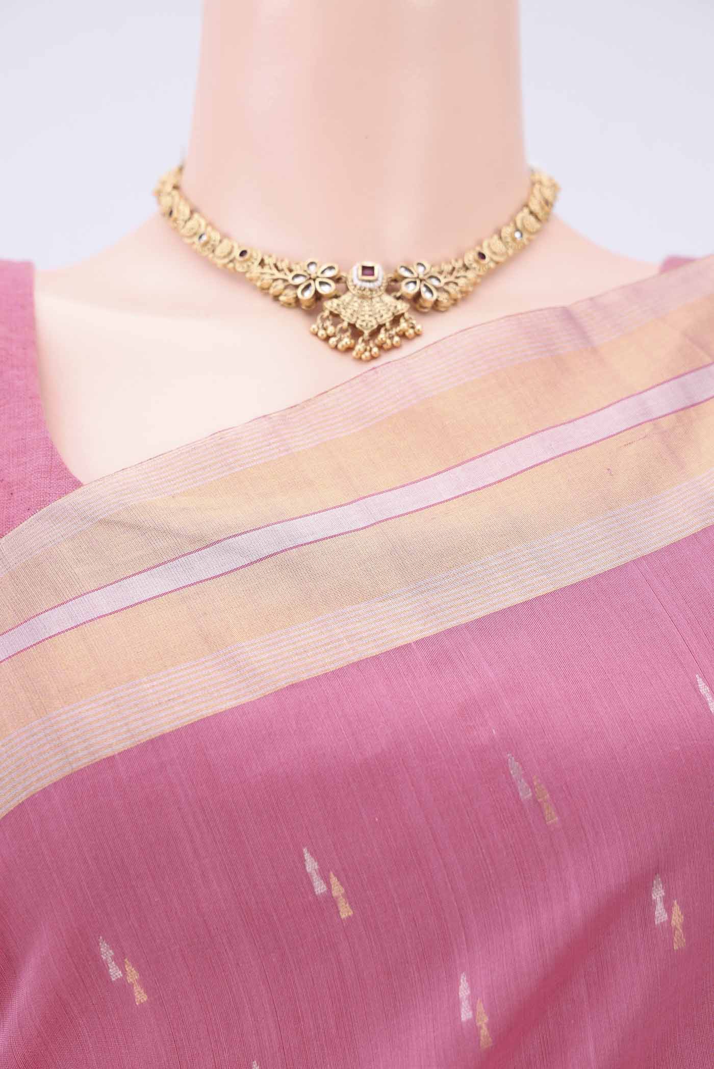 Border image of Rose pink Silk Cotton Saree with Zari Butta on the body and Zari Border. 