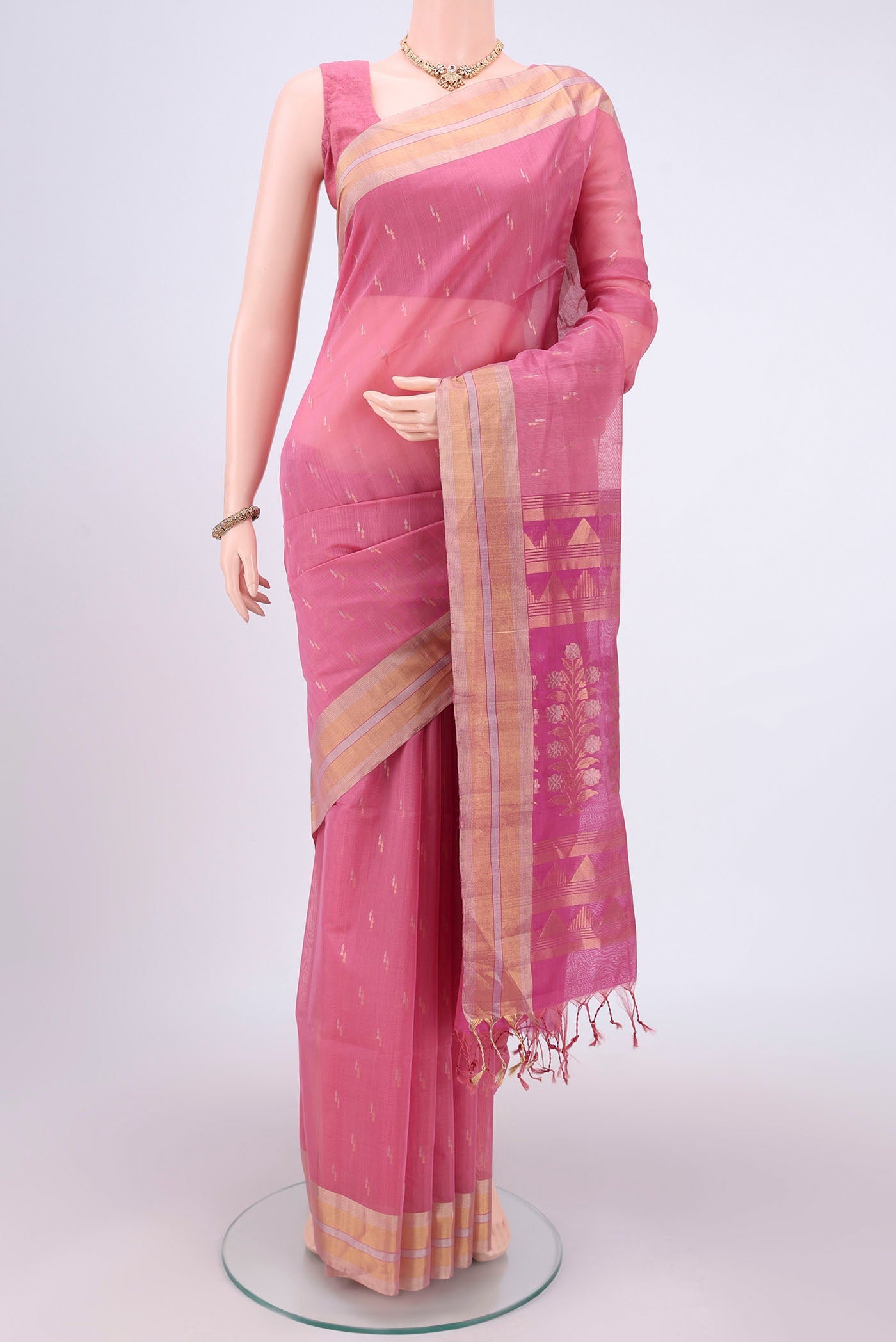 Rose pink Silk Cotton Saree with Zari Butta on the body and Zari Border.  displayed on a mannequin