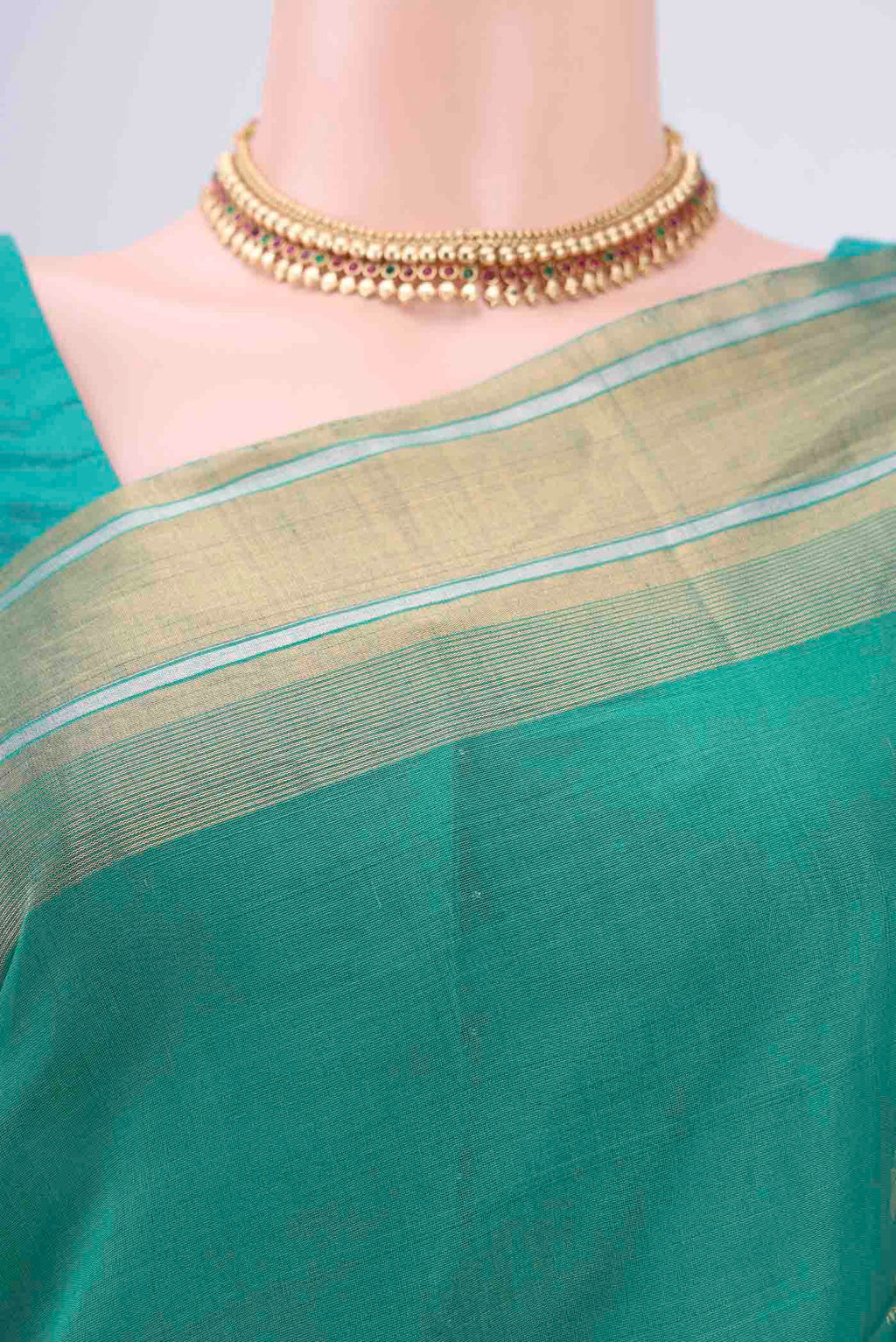Border image of Sea Green Silk Cotton Saree with Zari Butta on the body and Zari Border. 