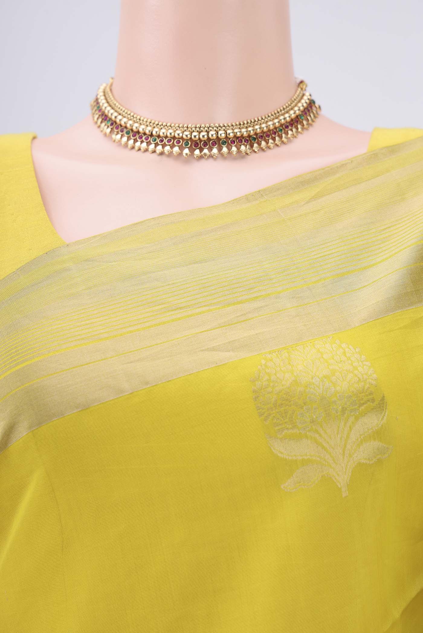 Border image of Lemon Yellow Silk Cotton Saree with Zari Butta on the body and Zari Border. 
