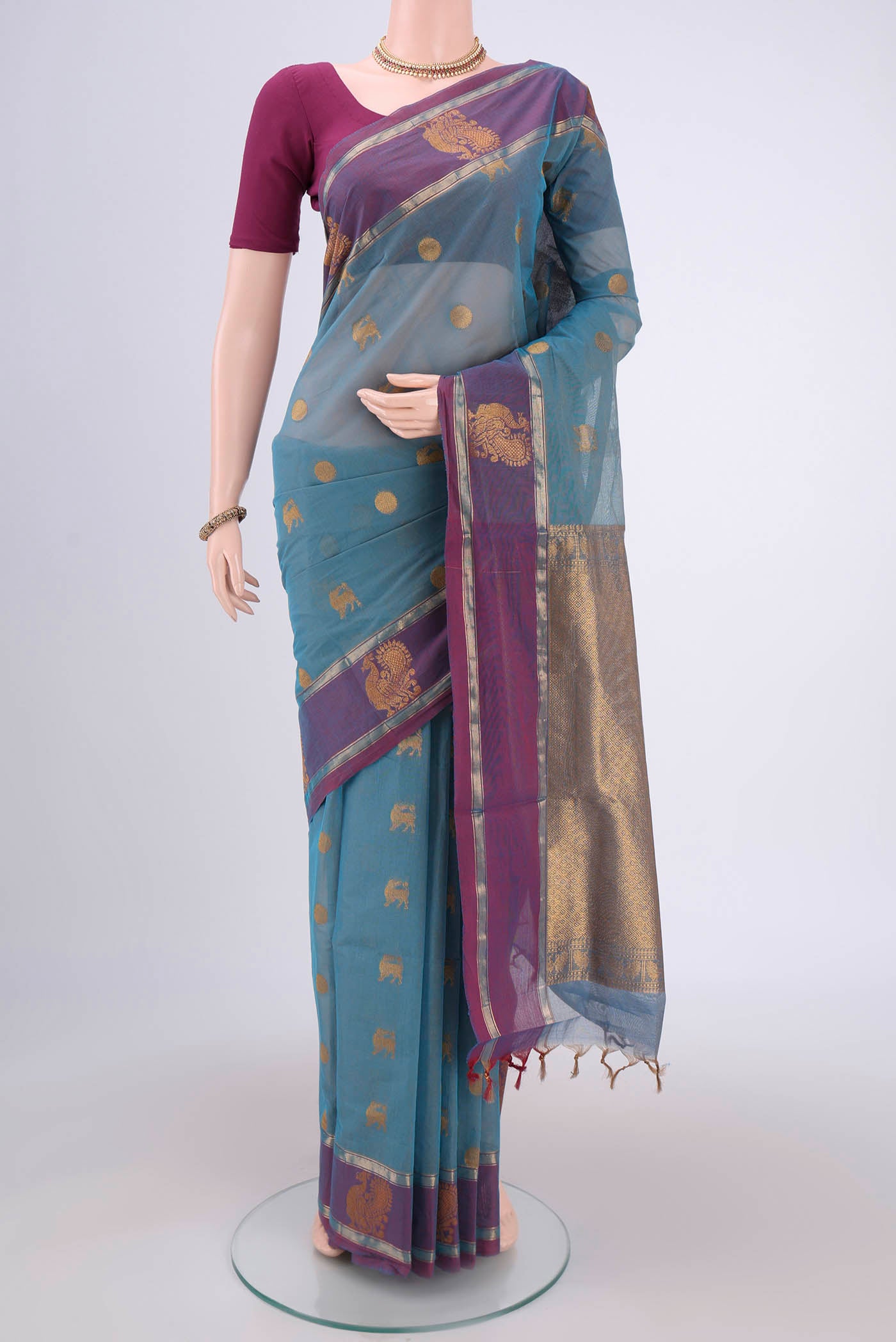 Light Blue Coimbatore Cotton Saree with Zari Butta on the body and Zari Border.  displayed on a mannequin