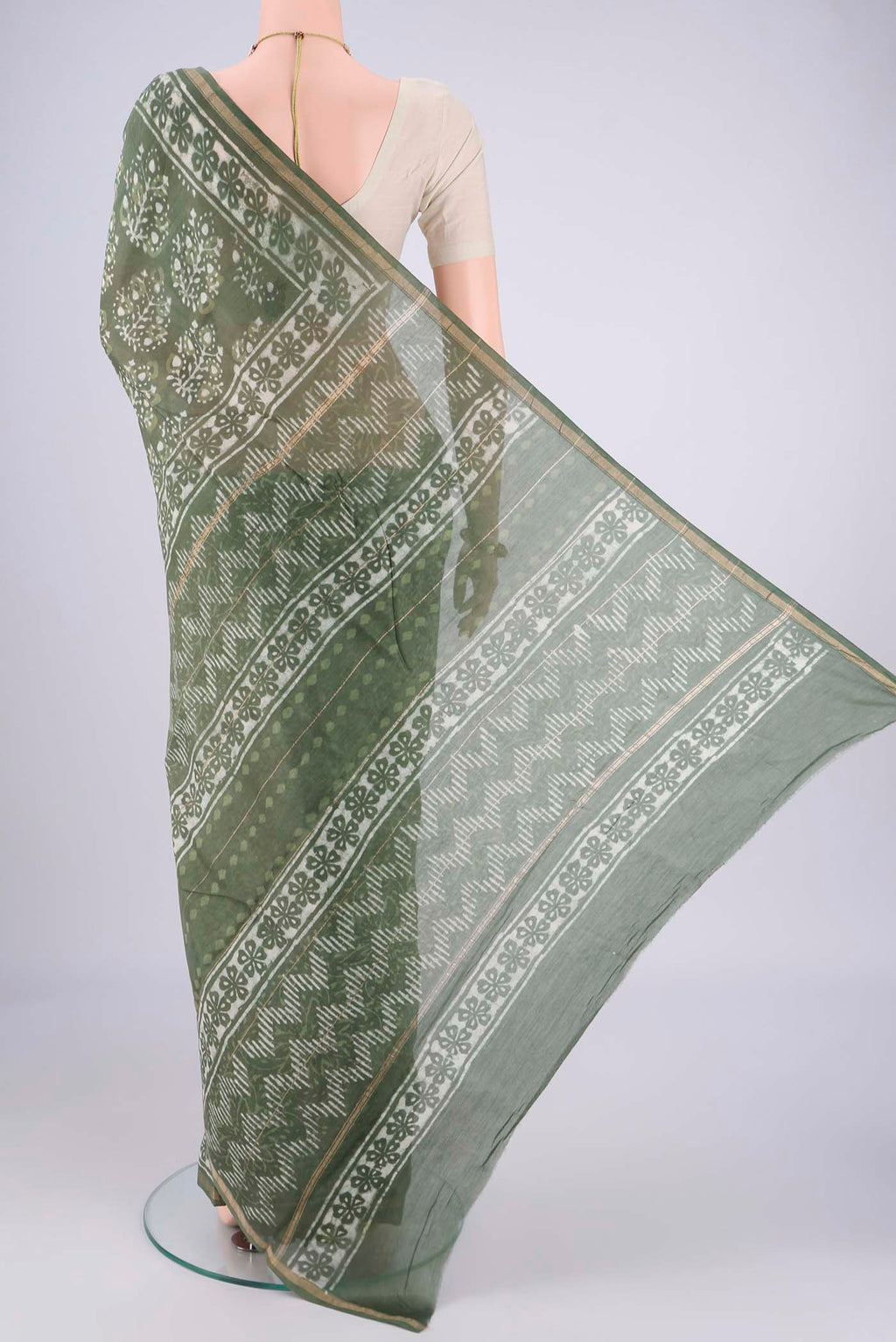 Flat view of Sea Green Maheshwari Silk Cotton Saree with Batik Print on the body and Zari Border. 