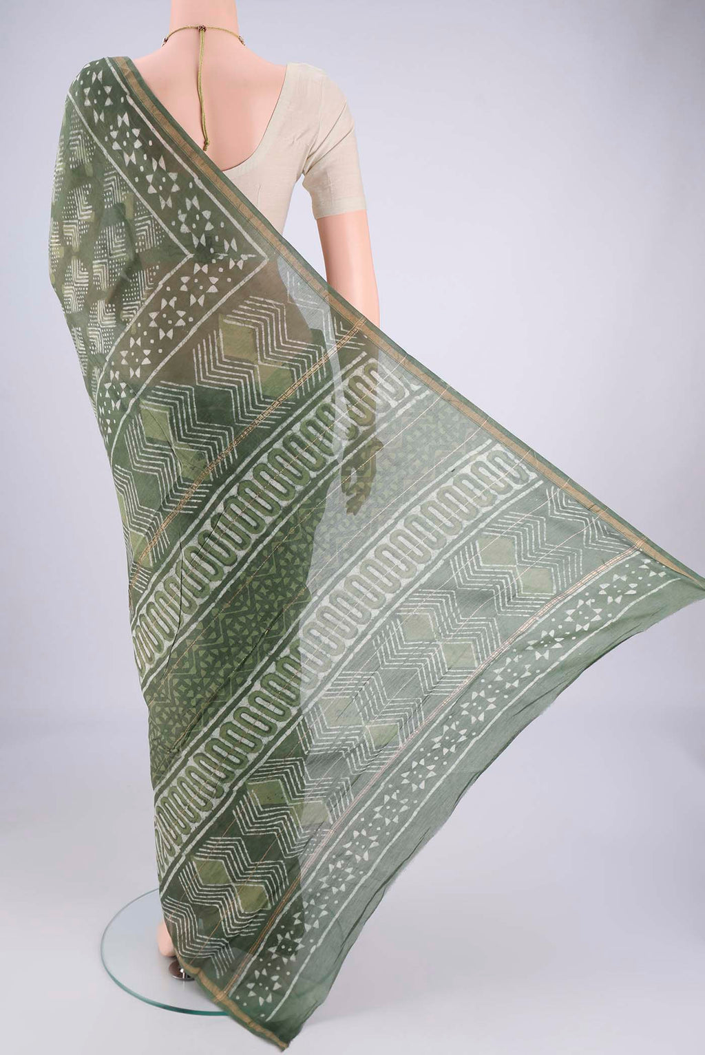 Flat view of Mehandi Green Maheshwari Silk Cotton Saree with Batik Print on the body and Zari Border. 