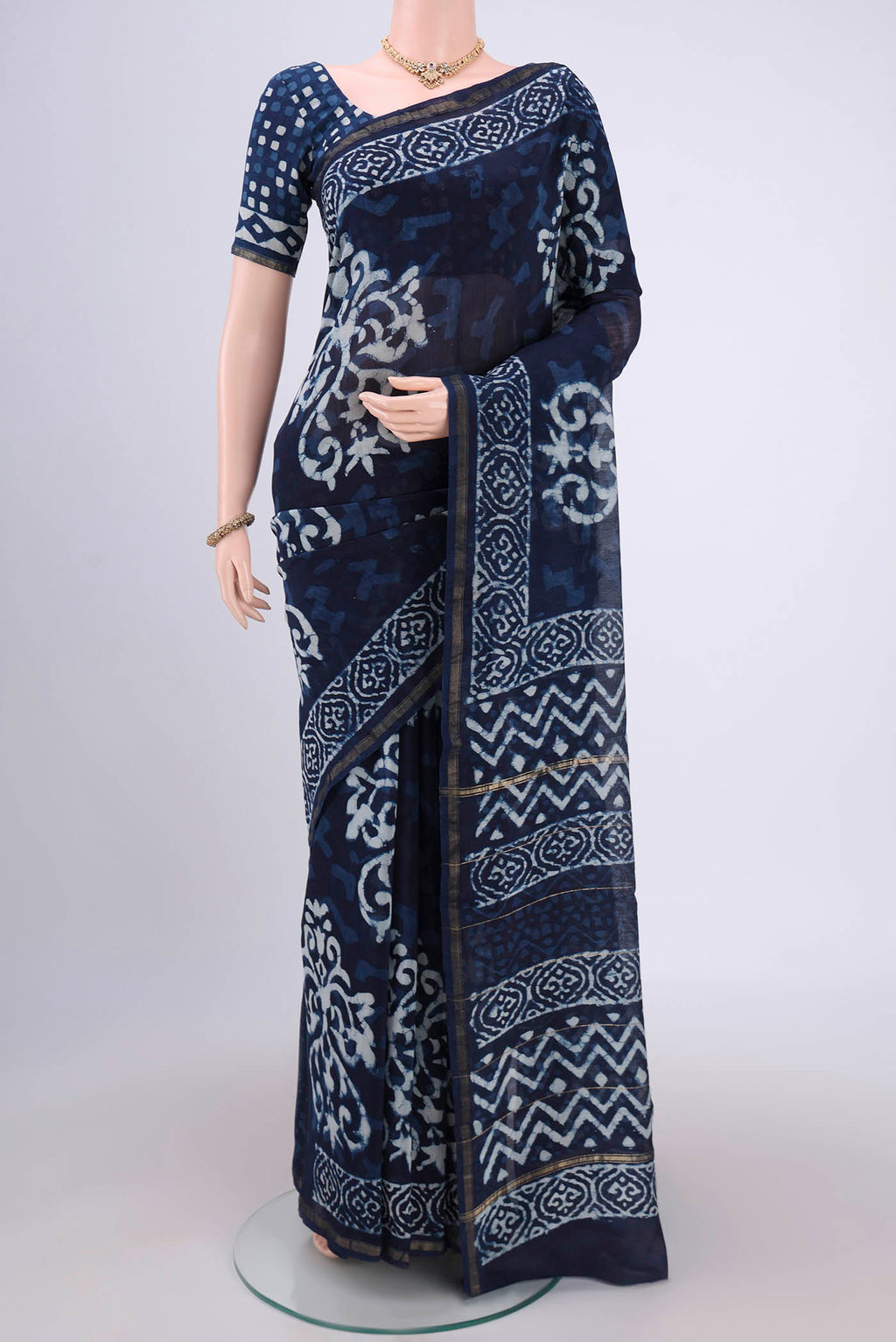 Indigo Chanderi Silk Saree with Batik Print on the body and Zari Border.  displayed on a mannequin
