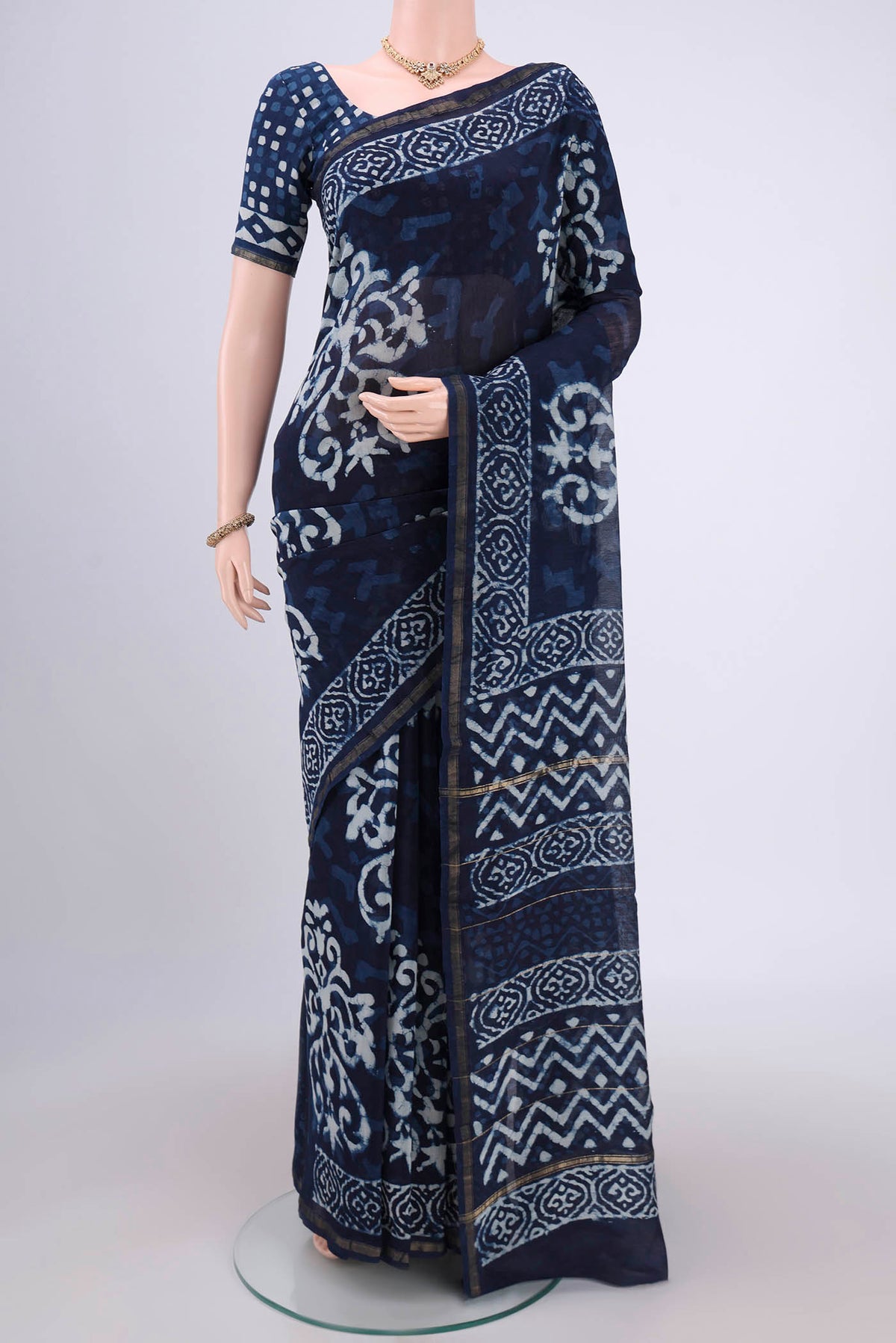 Indigo Chanderi Silk Saree with Batik Print on the body and Zari Border.  displayed on a mannequin