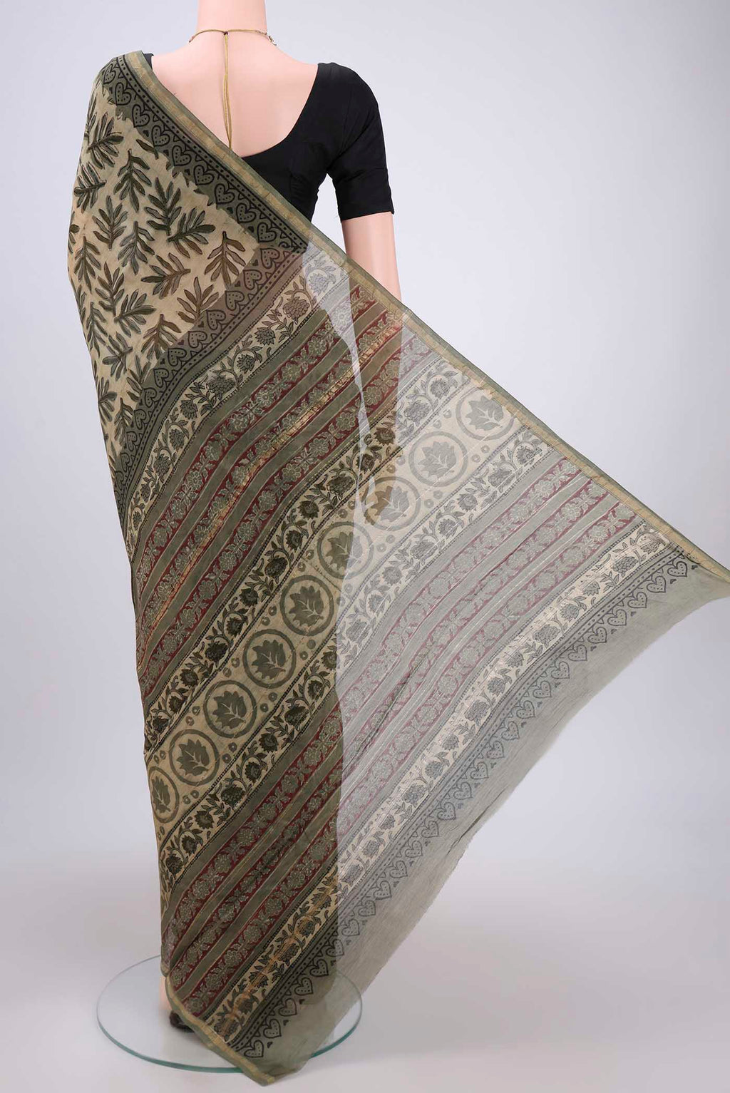 Flat view of Beige Chanderi Silk Saree with Batik Print on the body and Zari Border. 