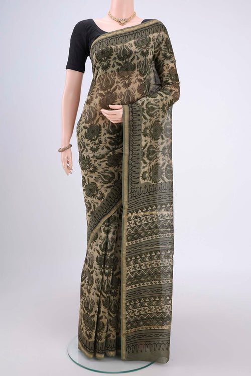 Mehandi Green Maheshwari Silk Cotton Saree with Batik Print on the body and Zari Border.  displayed on a mannequin