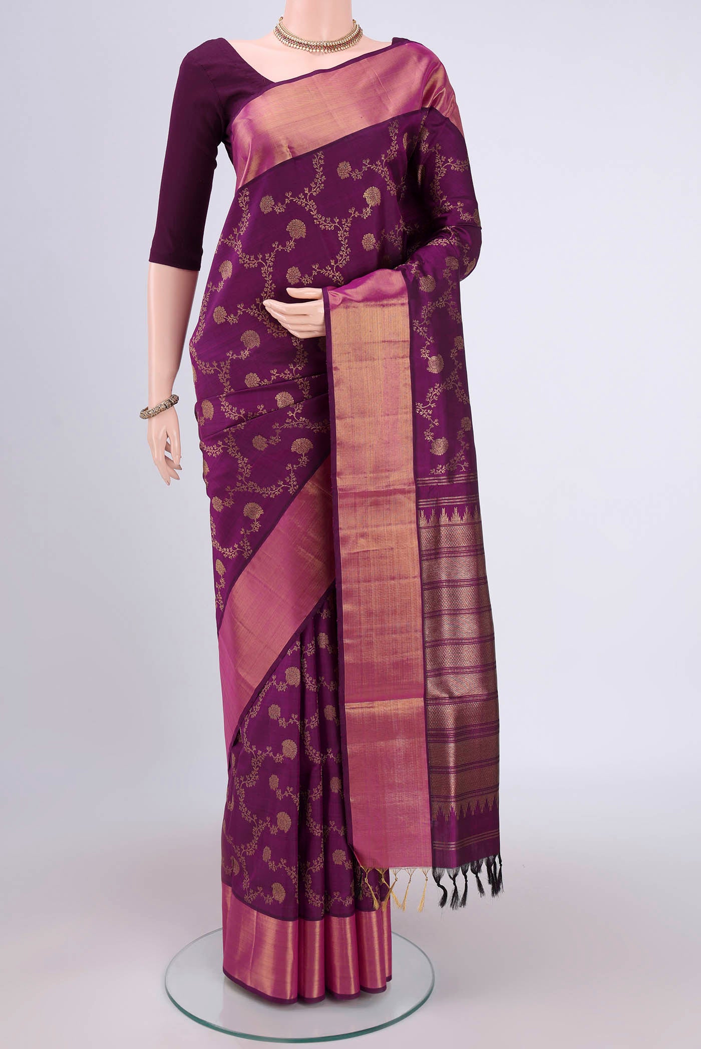 Purple Uppada Silk Saree with Zari Brocade on the body and Zari Border.  displayed on a mannequin