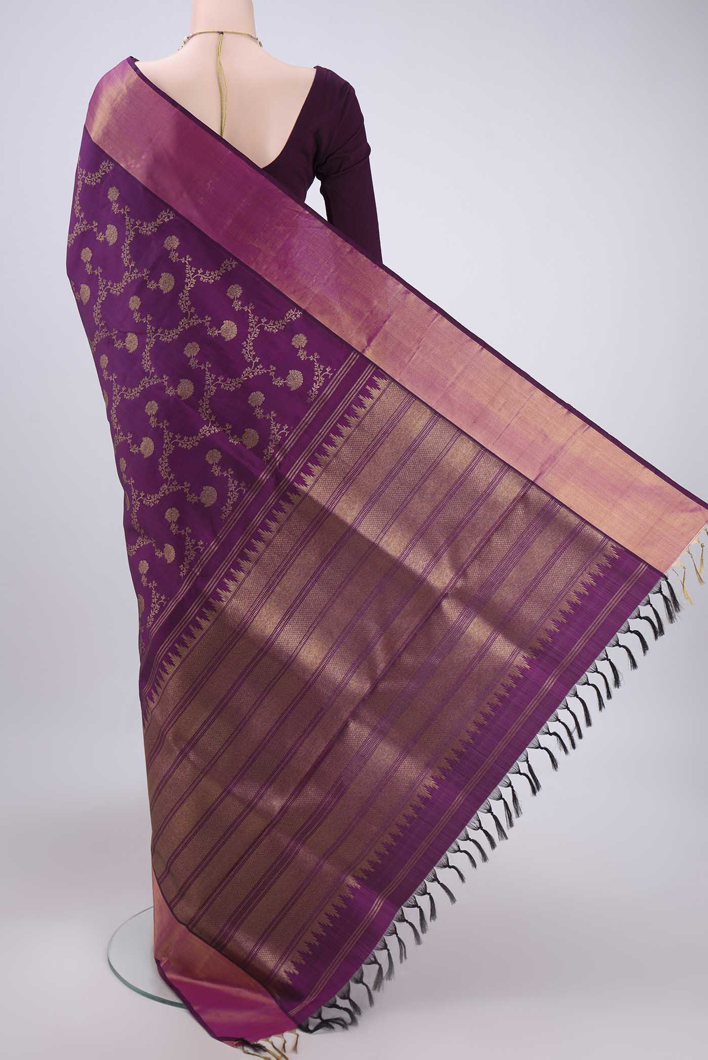 Flat view of Purple Uppada Silk Saree with Zari Brocade on the body and Zari Border. 