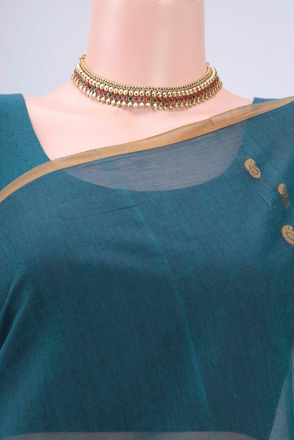 Border image of Peacock Blue Cotton Saree with Zari Butta on the body and Zari Border. 
