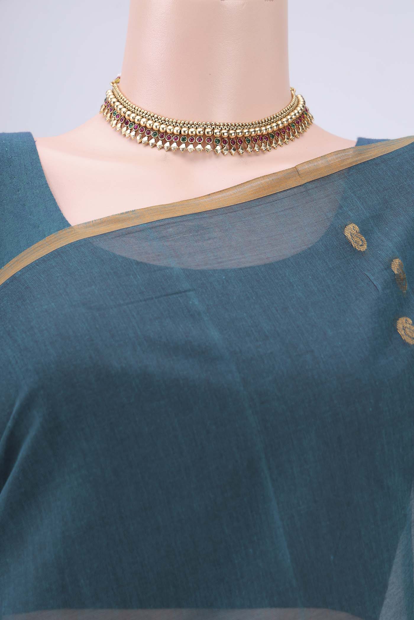 Border image of Peacock Blue Cotton Saree with Zari Butta on the body and Zari Border. 