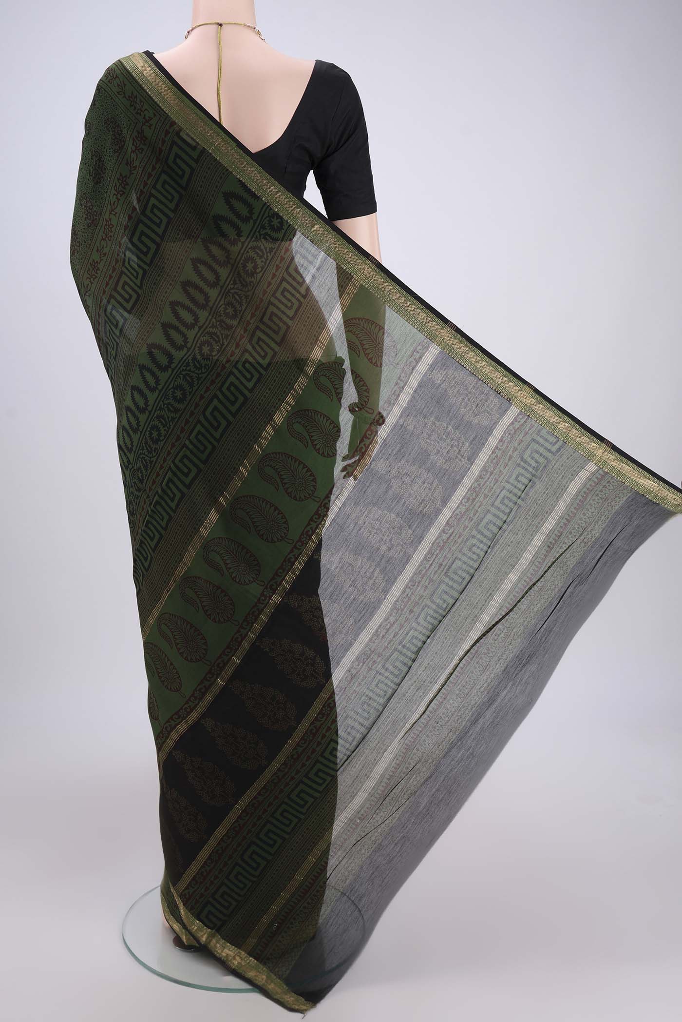 Flat view of Red Maheshwari Silk Cotton Saree with Printed design on the body and Zari Border. 