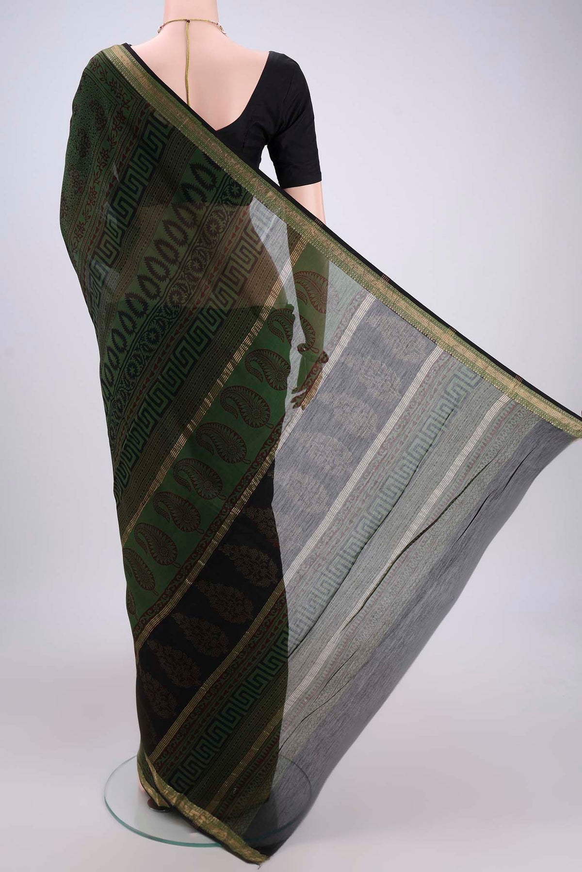 Flat view of Red Maheshwari Silk Cotton Saree with Printed design on the body and Zari Border. 