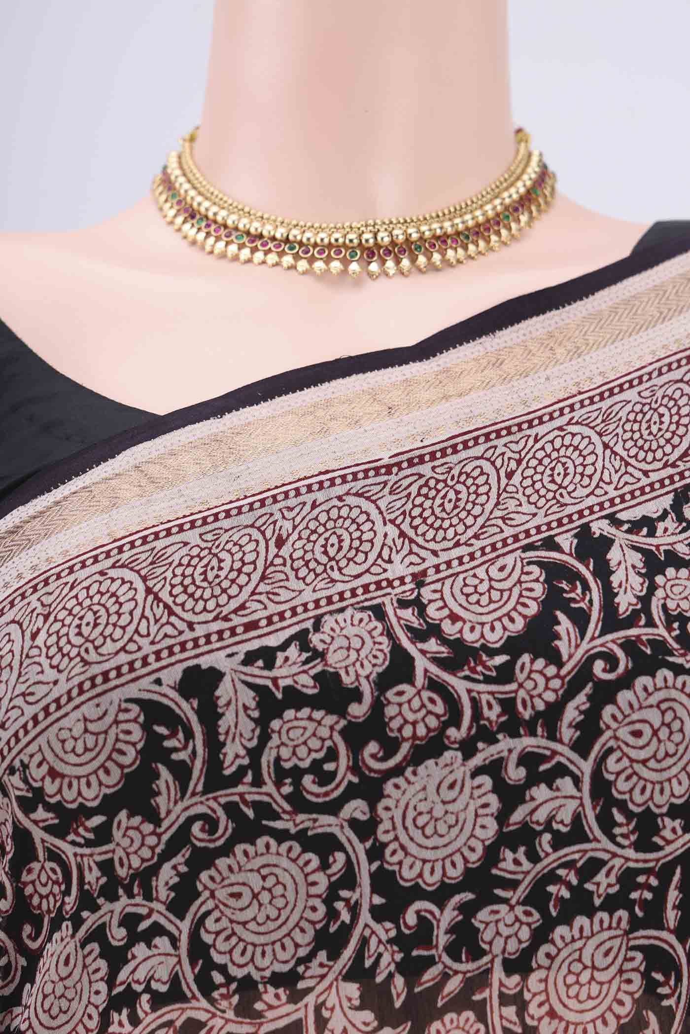 Border image of Black Maheshwari Silk Cotton Saree with Printed design on the body and Zari Border. 