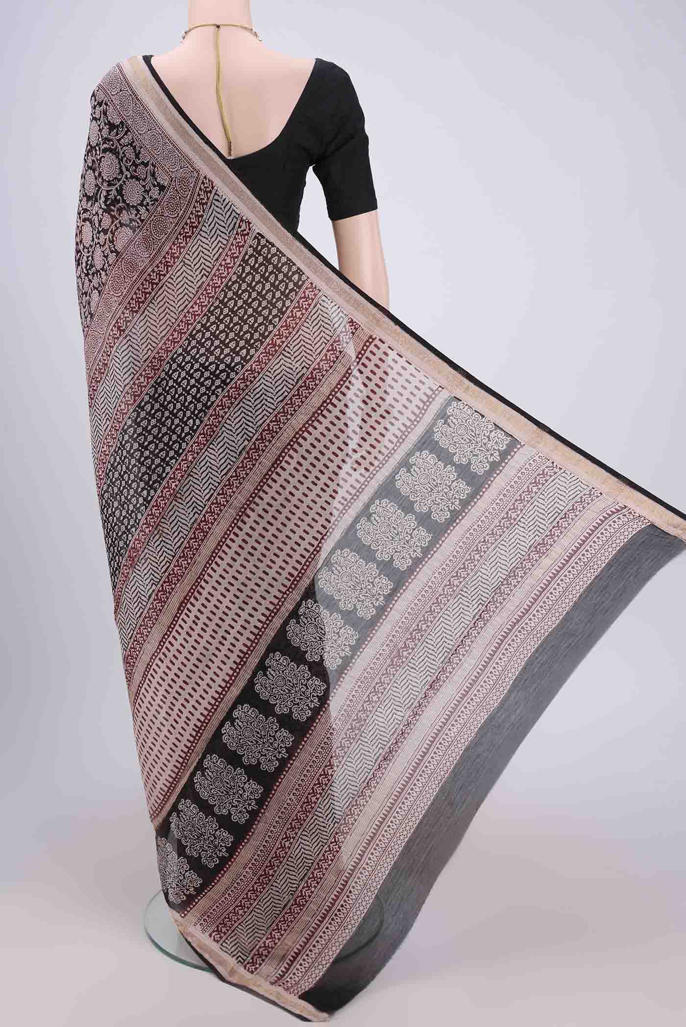Flat view of Black Maheshwari Silk Cotton Saree with Printed design on the body and Zari Border. 