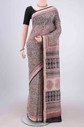 Beige Maheshwari Silk Cotton Saree with Printed design on the body and Zari Border.  displayed on a mannequin