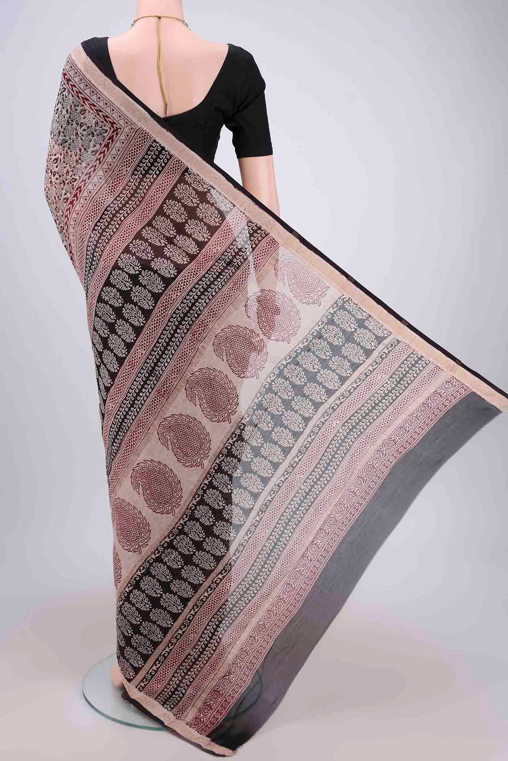 Flat view of Beige Maheshwari Silk Cotton Saree with Printed design on the body and Zari Border. 