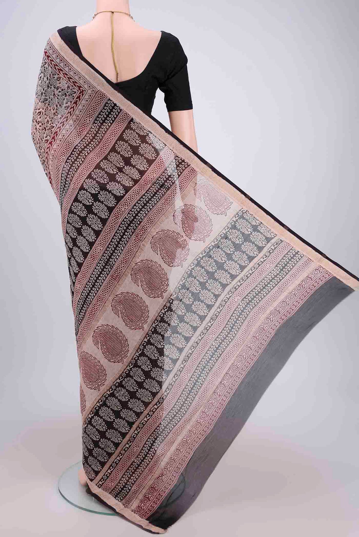 Flat view of Beige Maheshwari Silk Cotton Saree with Printed design on the body and Zari Border. 