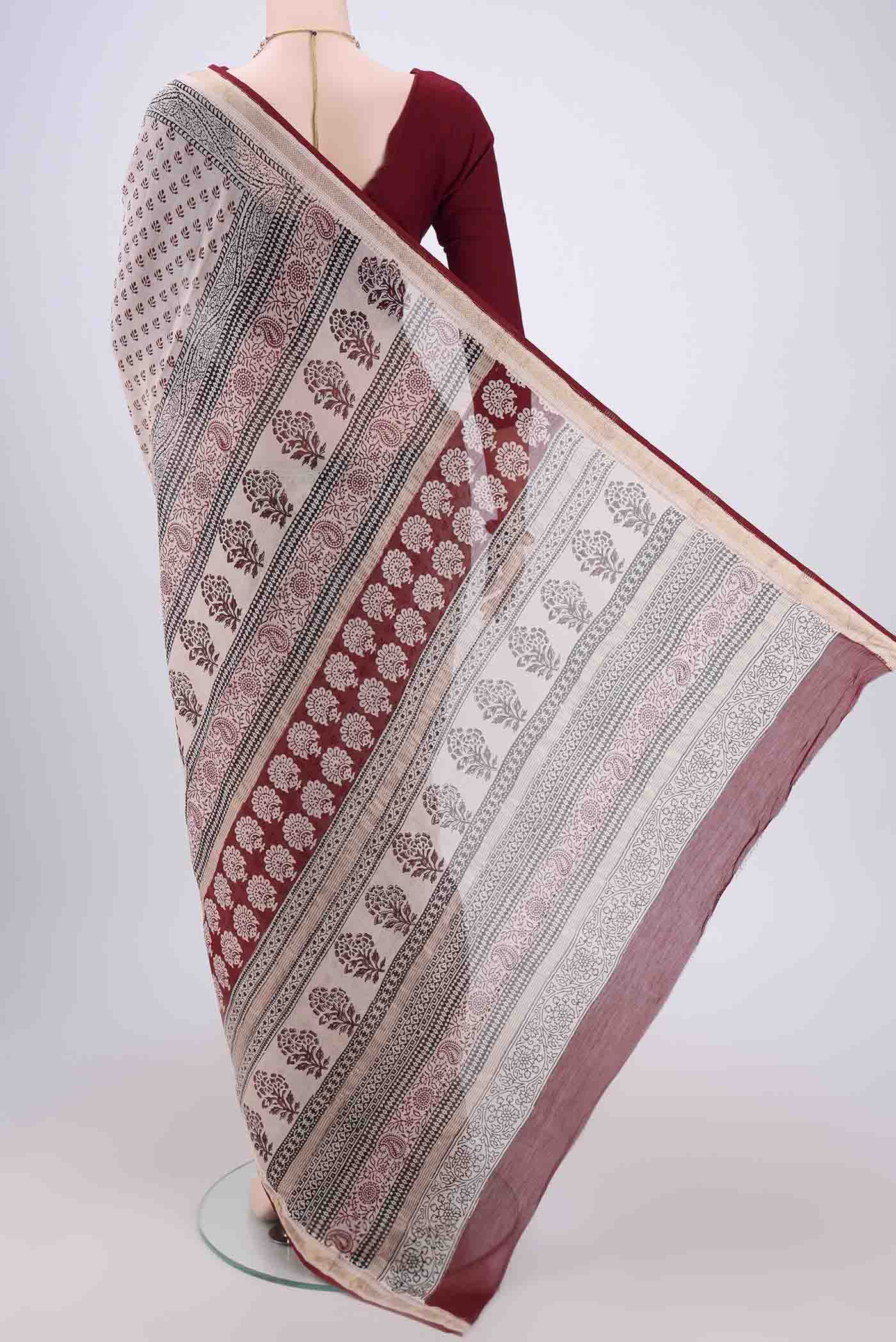Flat view of Beige Maheshwari Silk Cotton Saree with Printed design on the body and Zari Border. 
