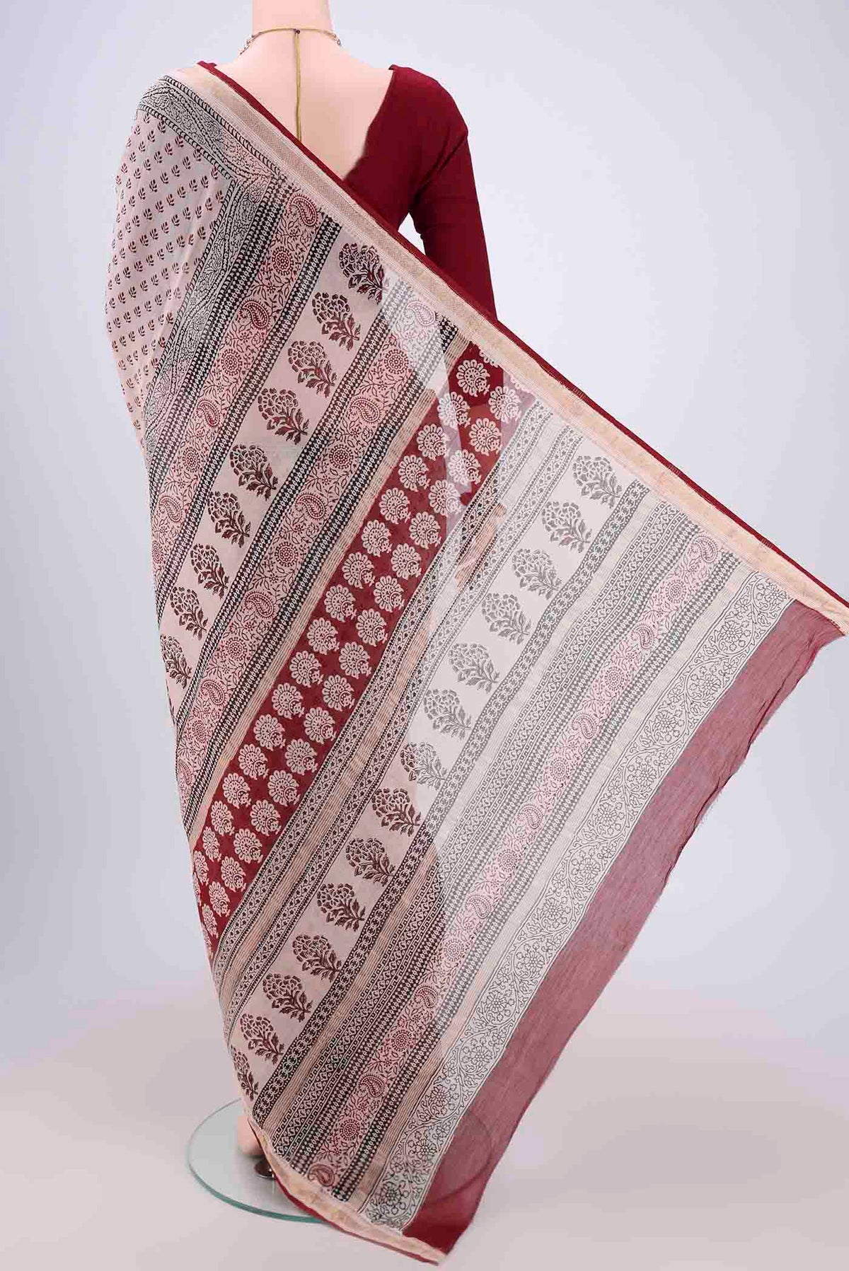 Flat view of Beige Maheshwari Silk Cotton Saree with Printed design on the body and Zari Border. 