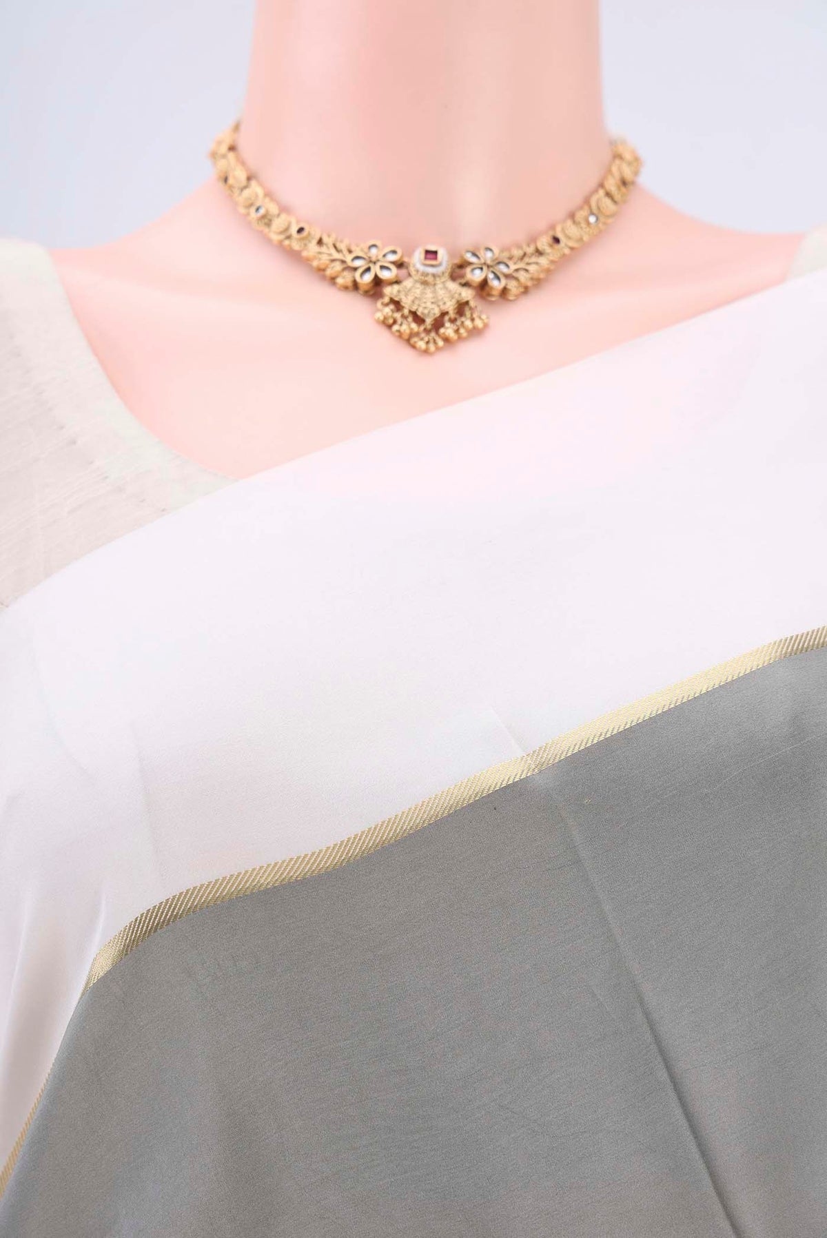 Border image of Pure Silk Pure Zari Grey Mysore Crepe Saree with Plain Body and Zari Border. 