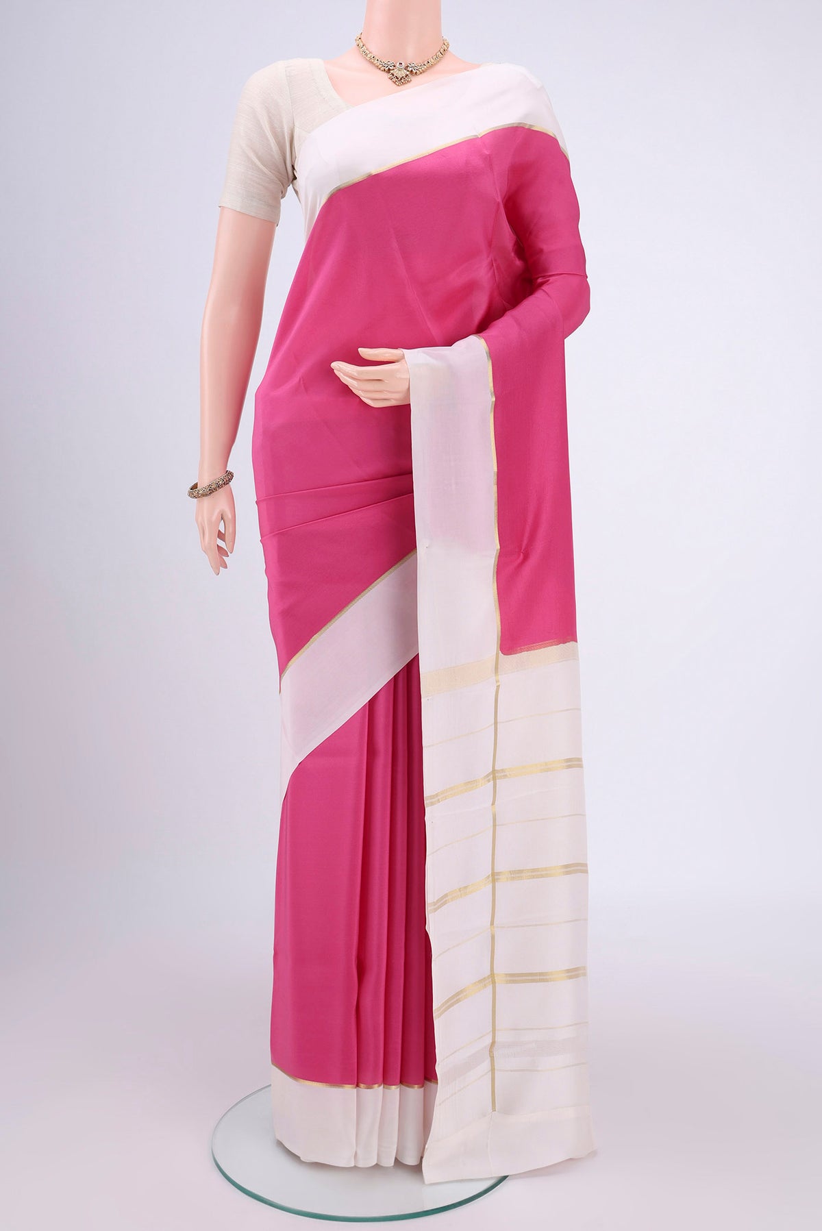 Pure Silk Pure Zari Rose pink Mysore Crepe Saree with Plain Body and Zari Border.  displayed on a mannequin