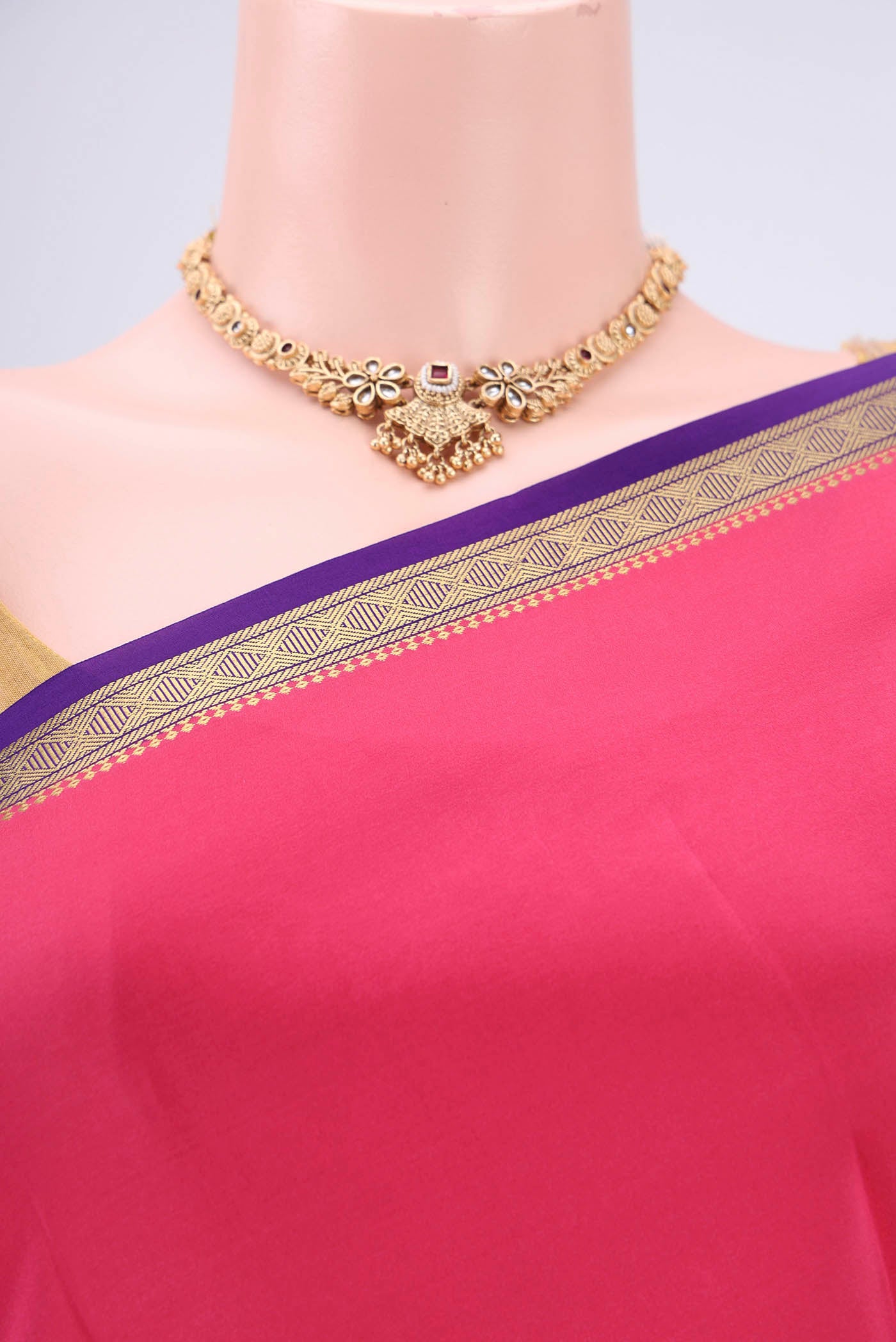 Border image of Pure Silk Pure Zari Dark Pink Mysore Crepe Saree with Plain Body and Zari Border. 