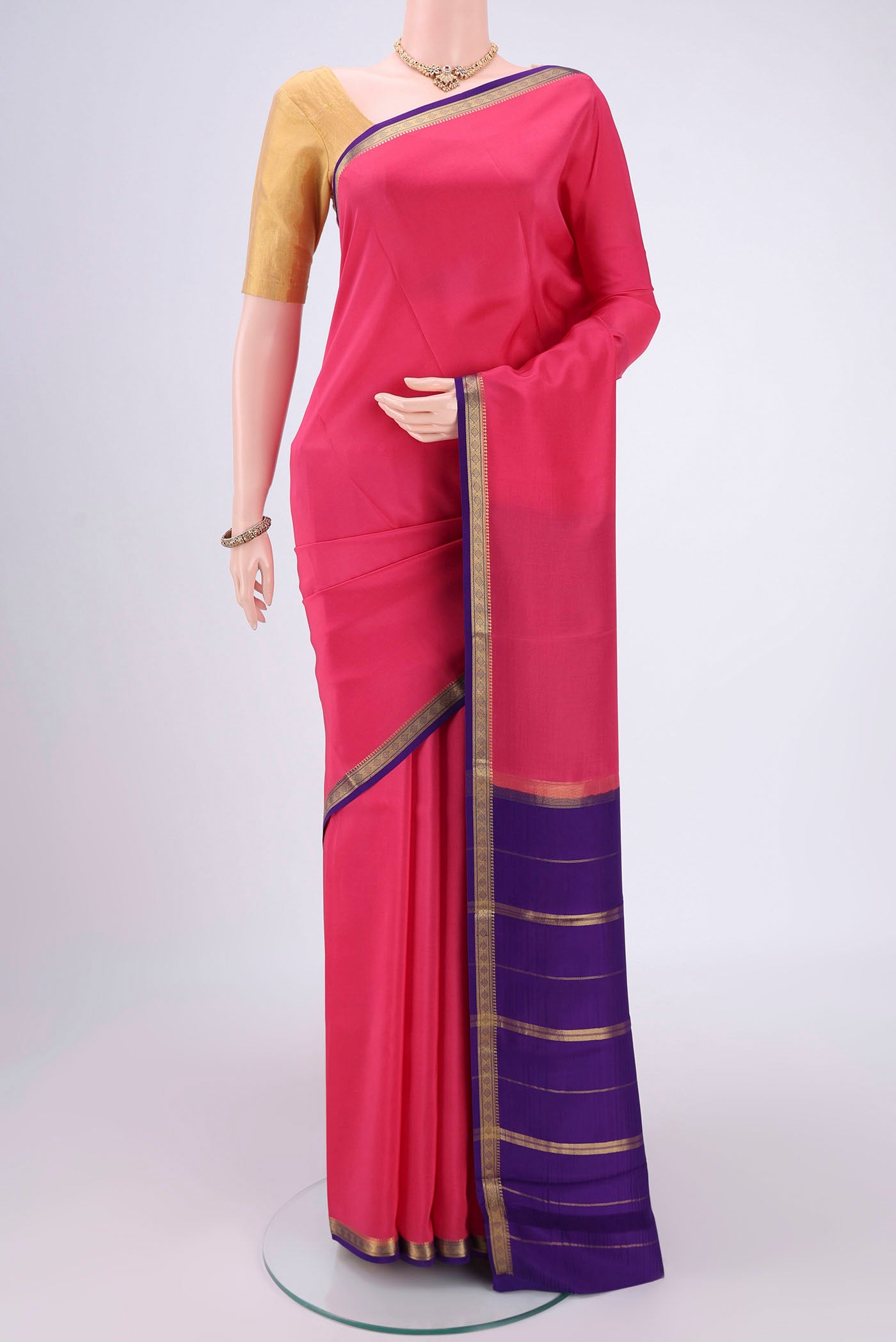 Pure Silk Pure Zari Dark Pink Mysore Crepe Saree with Plain Body and Zari Border.  displayed on a mannequin