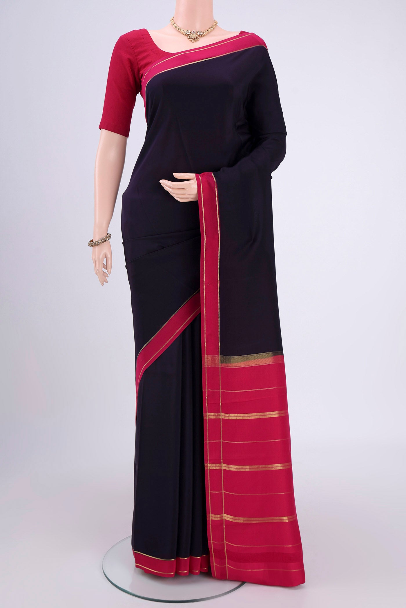 Pure Silk Pure Zari Navy Blue Mysore Crepe Saree with Plain Body and Zari Border.  displayed on a mannequin