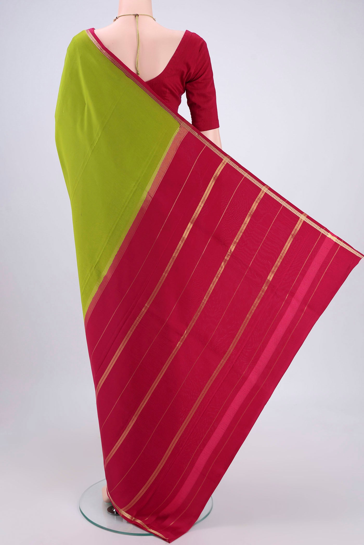 Flat view of Pure Silk Pure Zari Parrot Green Mysore Crepe Saree with Plain Body and Zari Border. 
