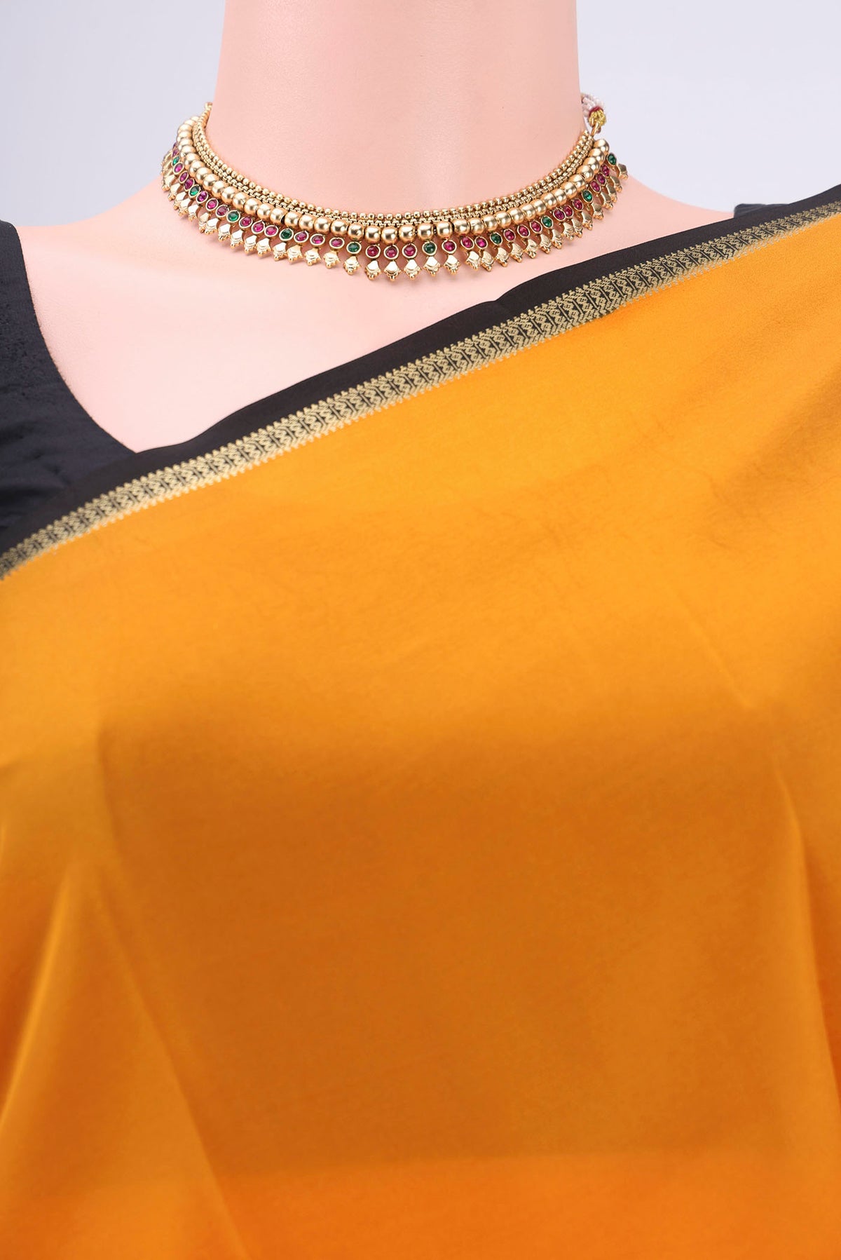 Border image of Pure Silk Pure Zari Mustard Mysore Crepe Saree with Plain Body and Zari Border. 