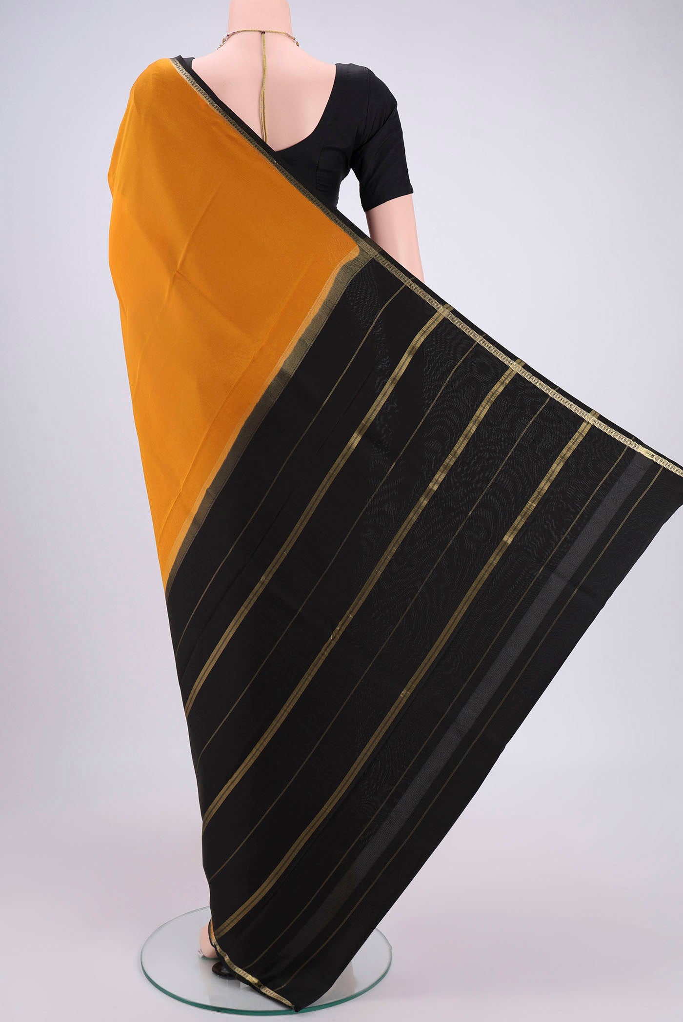 Flat view of Pure Silk Pure Zari Mustard Mysore Crepe Saree with Plain Body and Zari Border. 